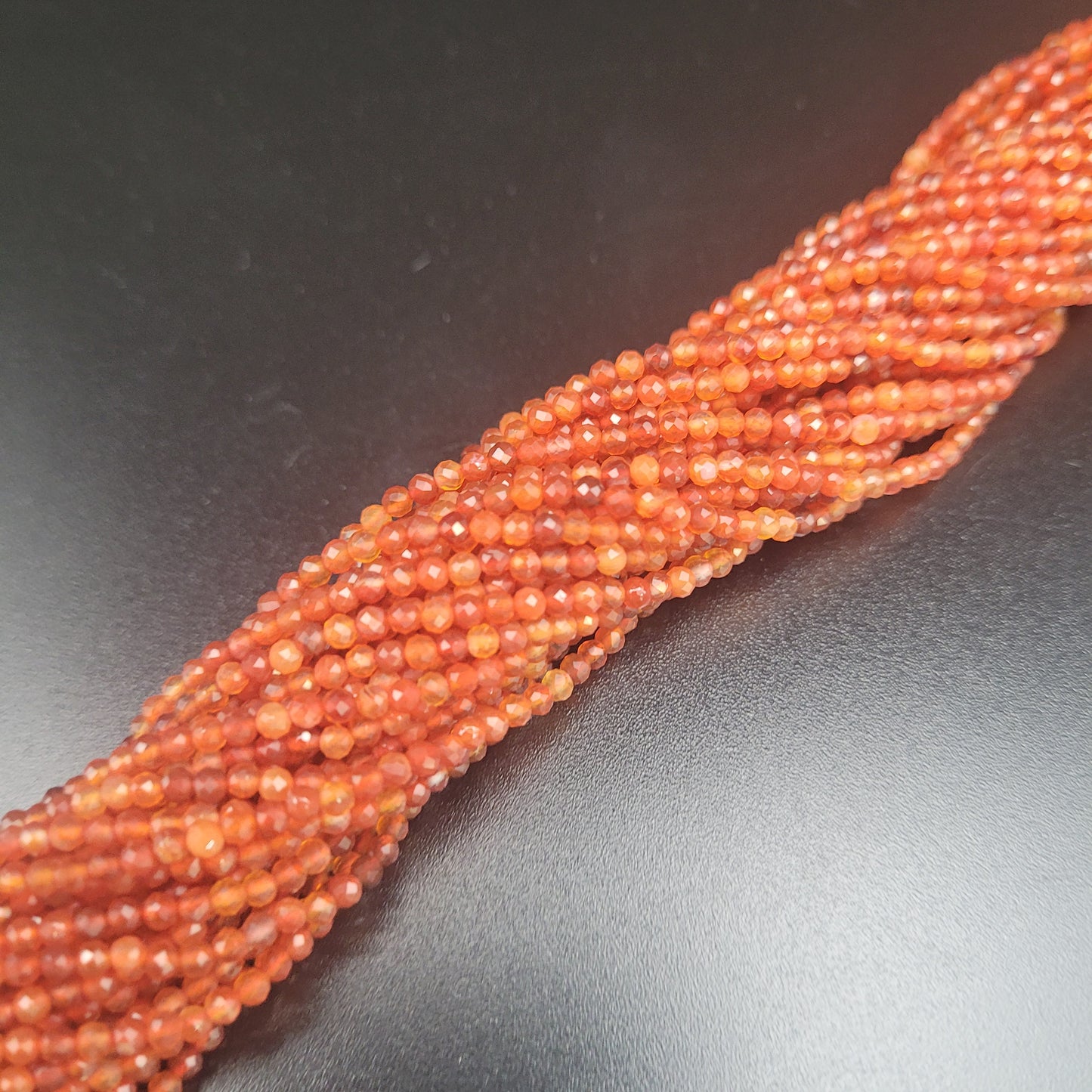 1.5mm Carnelian Faceted.