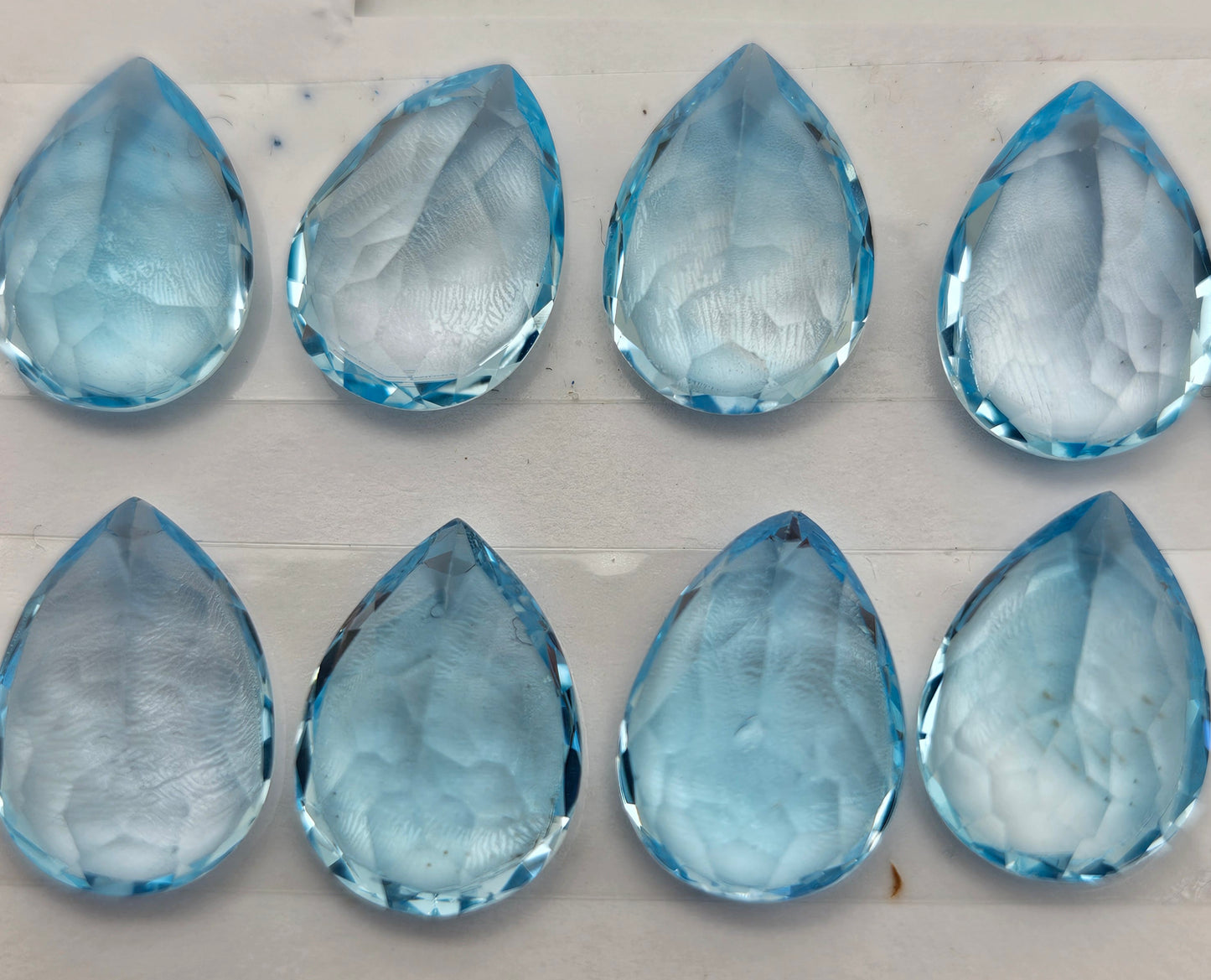 10 To 14mm Blue Topaz Teardrop Faceted Cabochon.