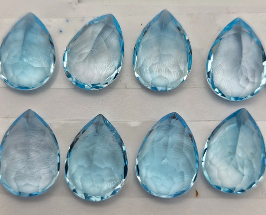 10 To 14mm Blue Topaz Teardrop Faceted Cabochon.