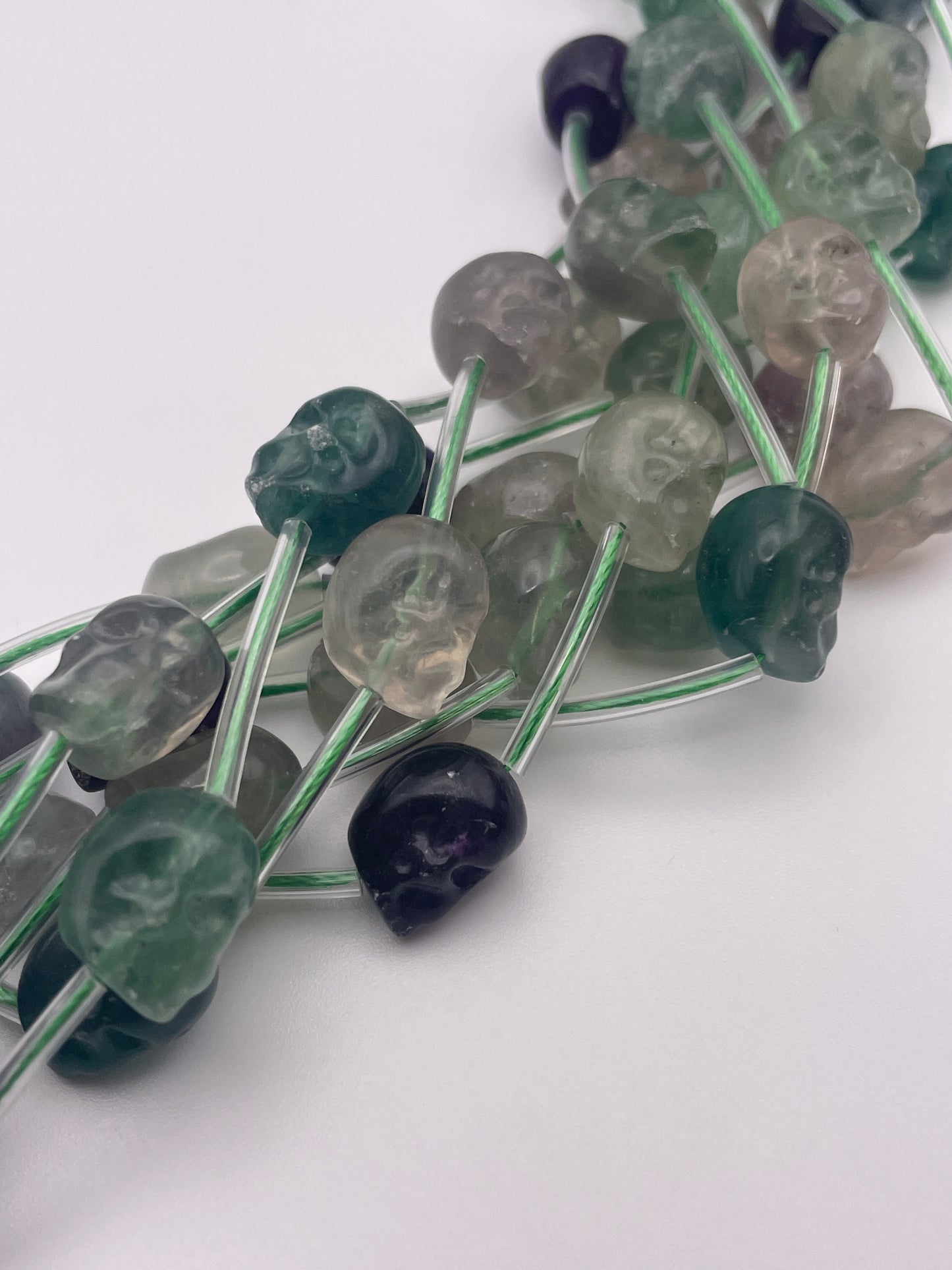 10mm Fluorite Vertical Drilled Skull Bead Strand.