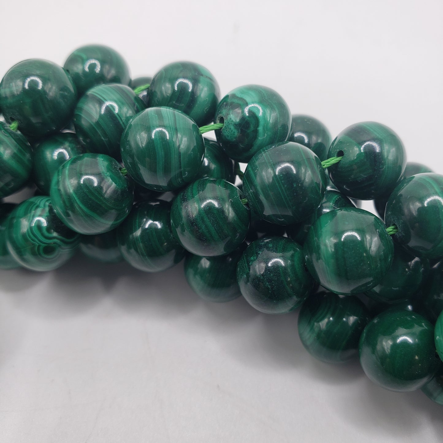 10mm Round Malachite bead strand.