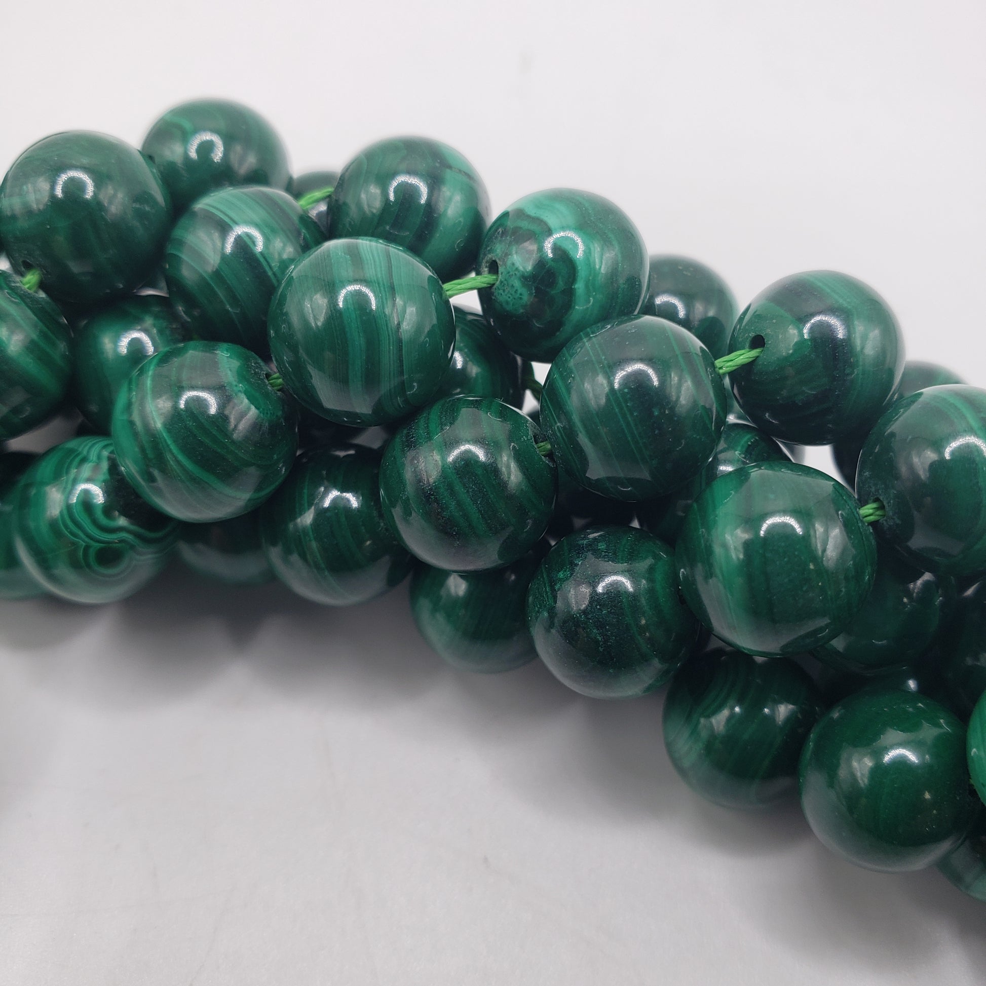 10mm Round Malachite bead strand.