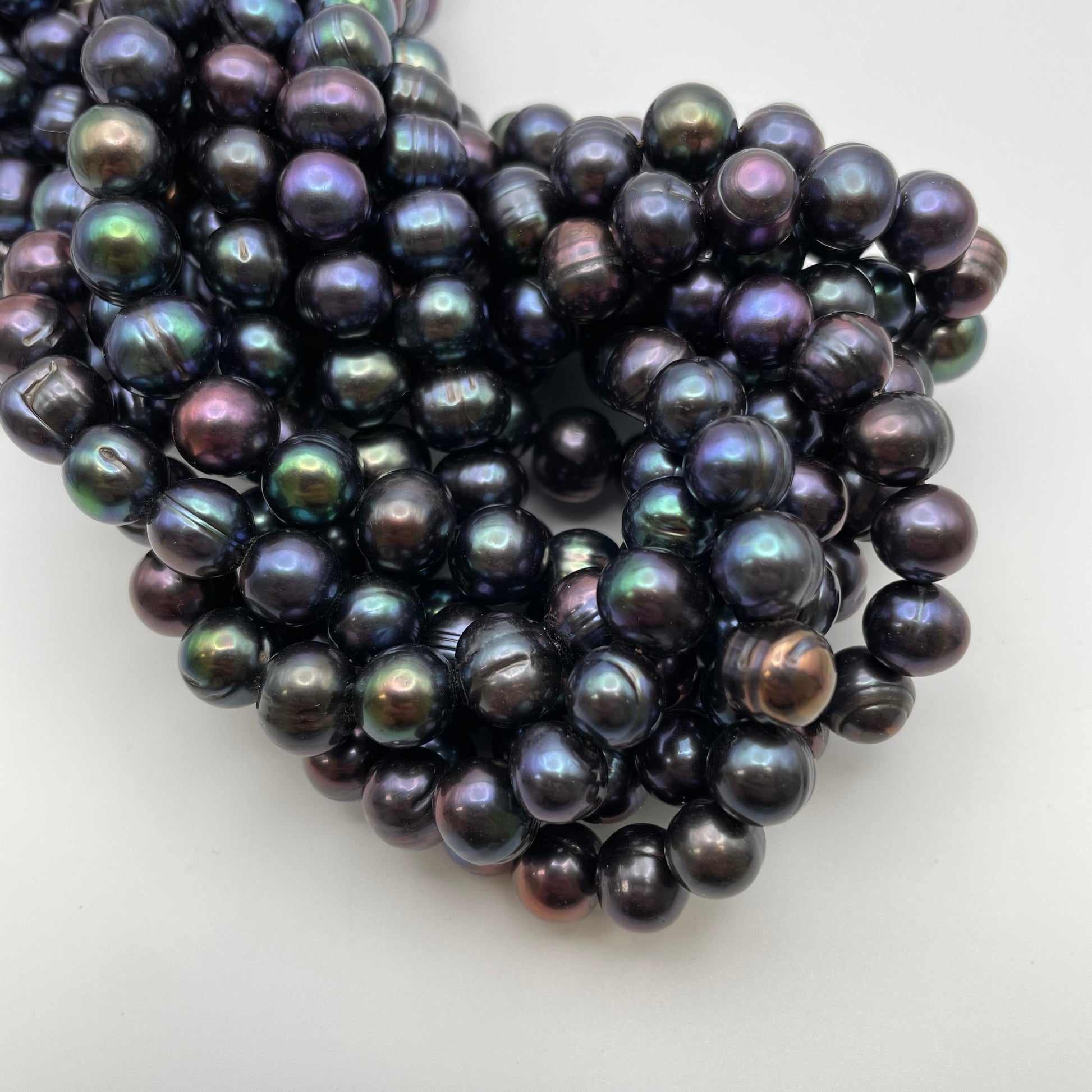 10mm Peacock Pearl Round Strand.