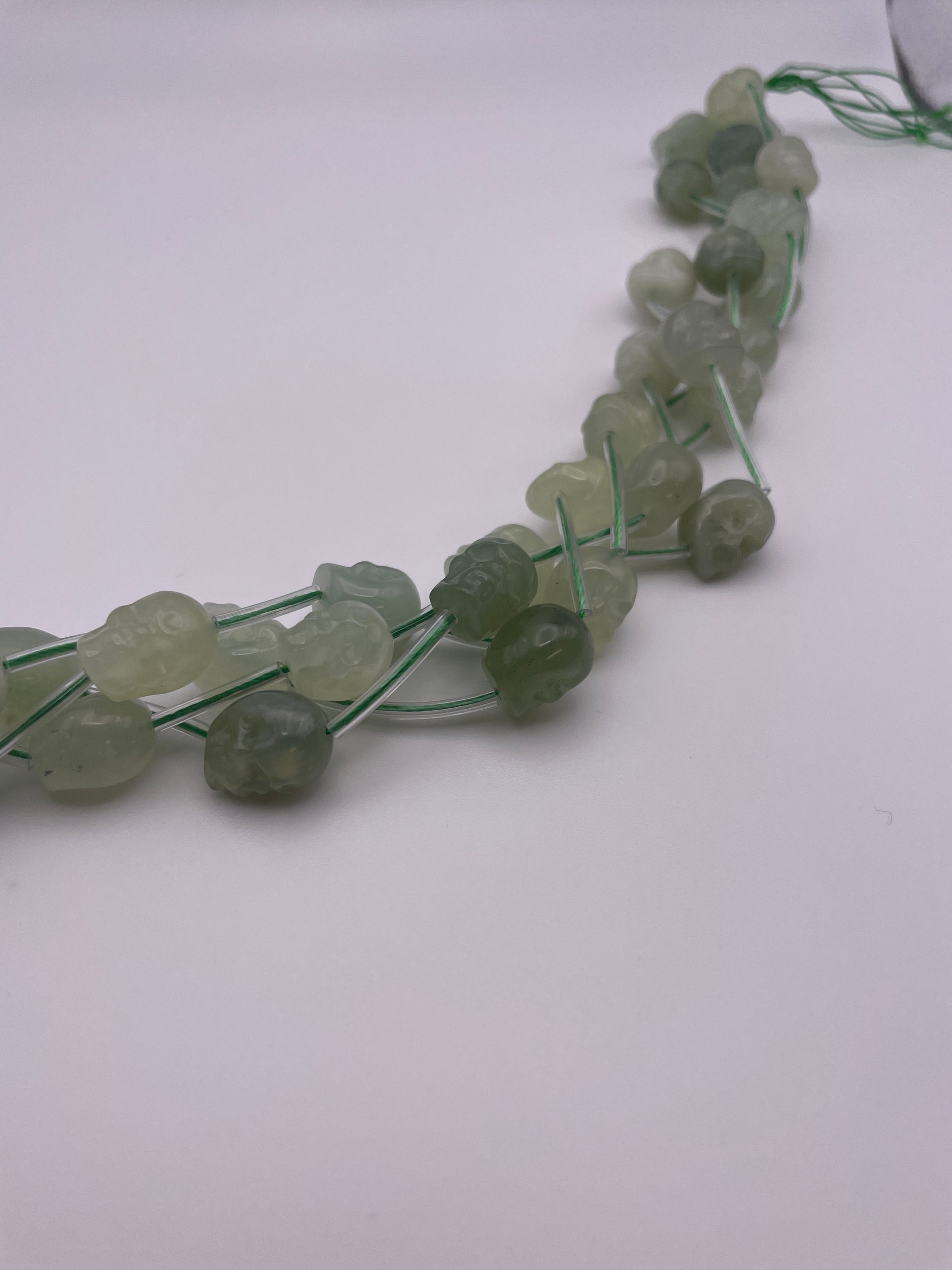 10mm Serpentine Vertical Drilled Skull Bead Strand.