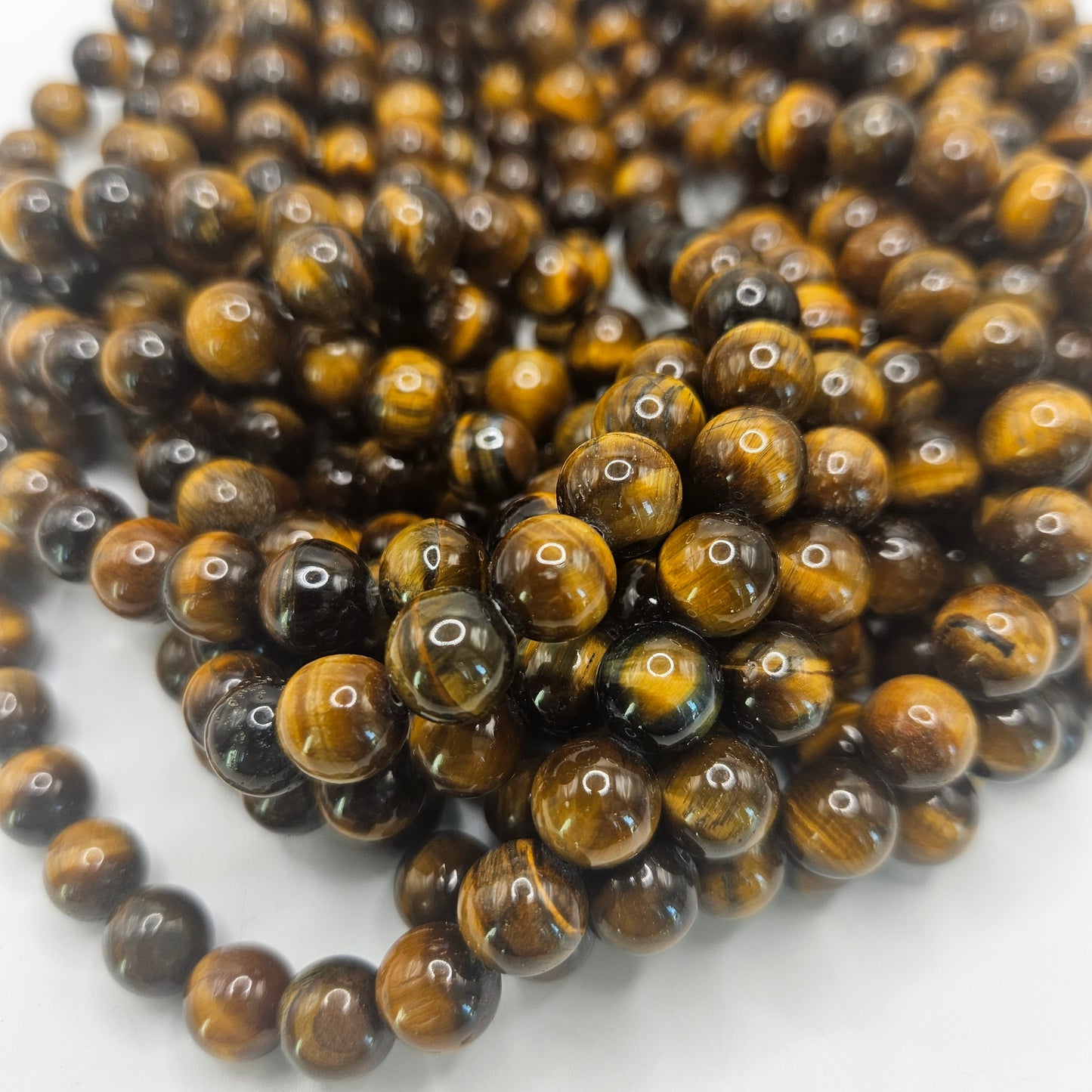 10mm tiger eye round bead strand.