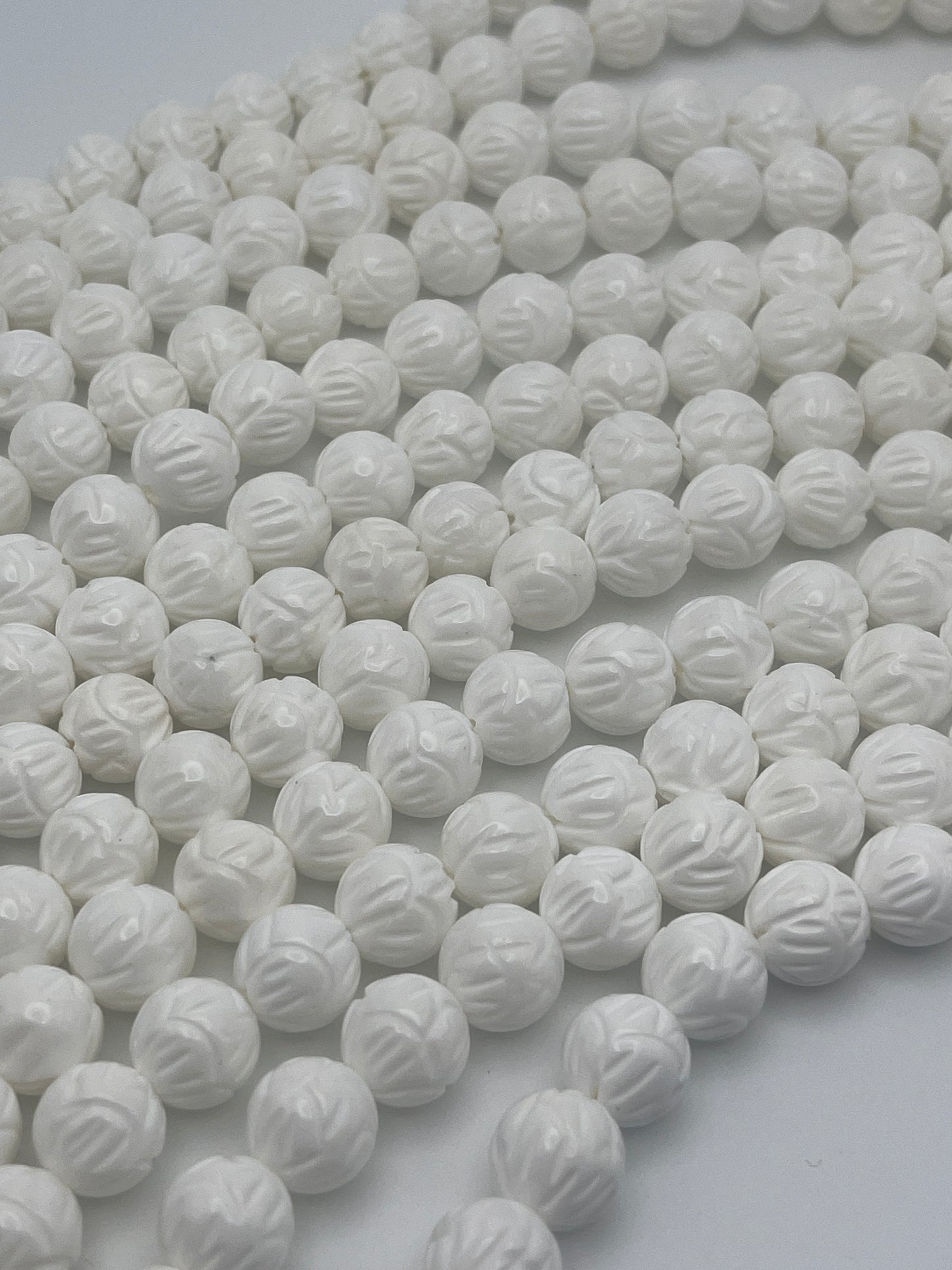 10mm Tridacna Shell Carved Bead Strand.