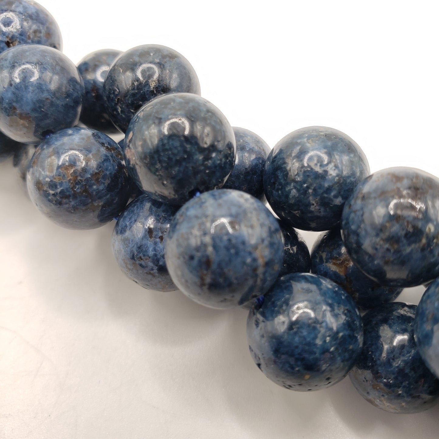 15 Inch Long Strand of 12mm Blue Spinel Beads.