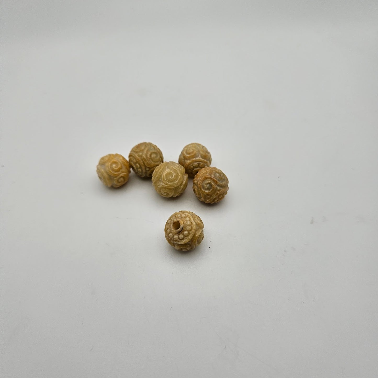 12mm Carved Yellow Jade Guru Bead.