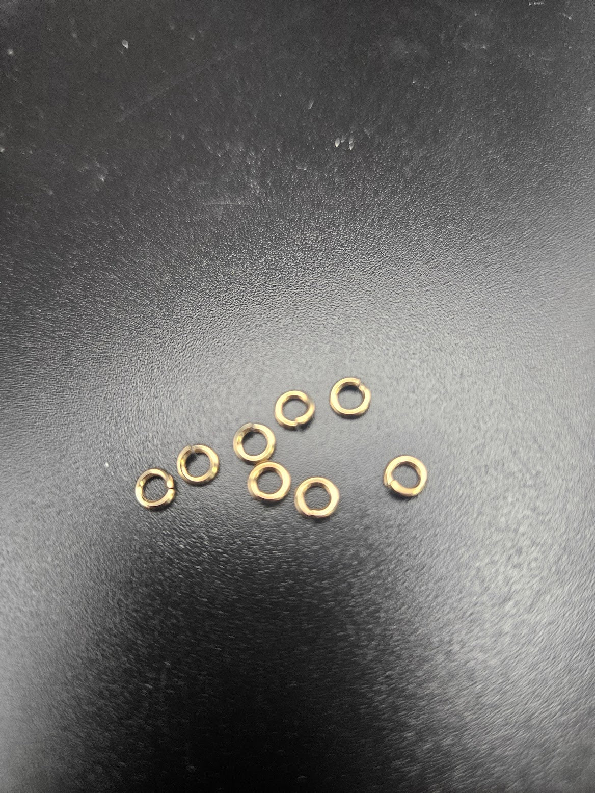 14k Gold mini jump rings.