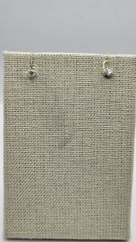 14k White Gold Diamond Studs.