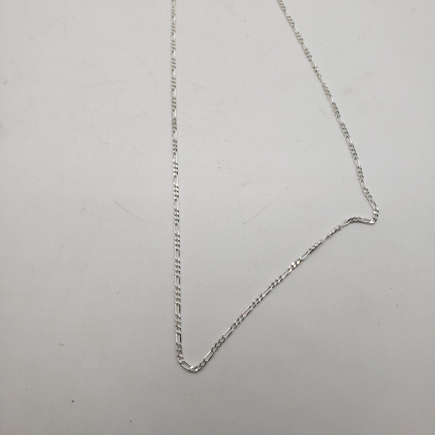 16 Inch Long Sterling Silver Figaro Link Chain.