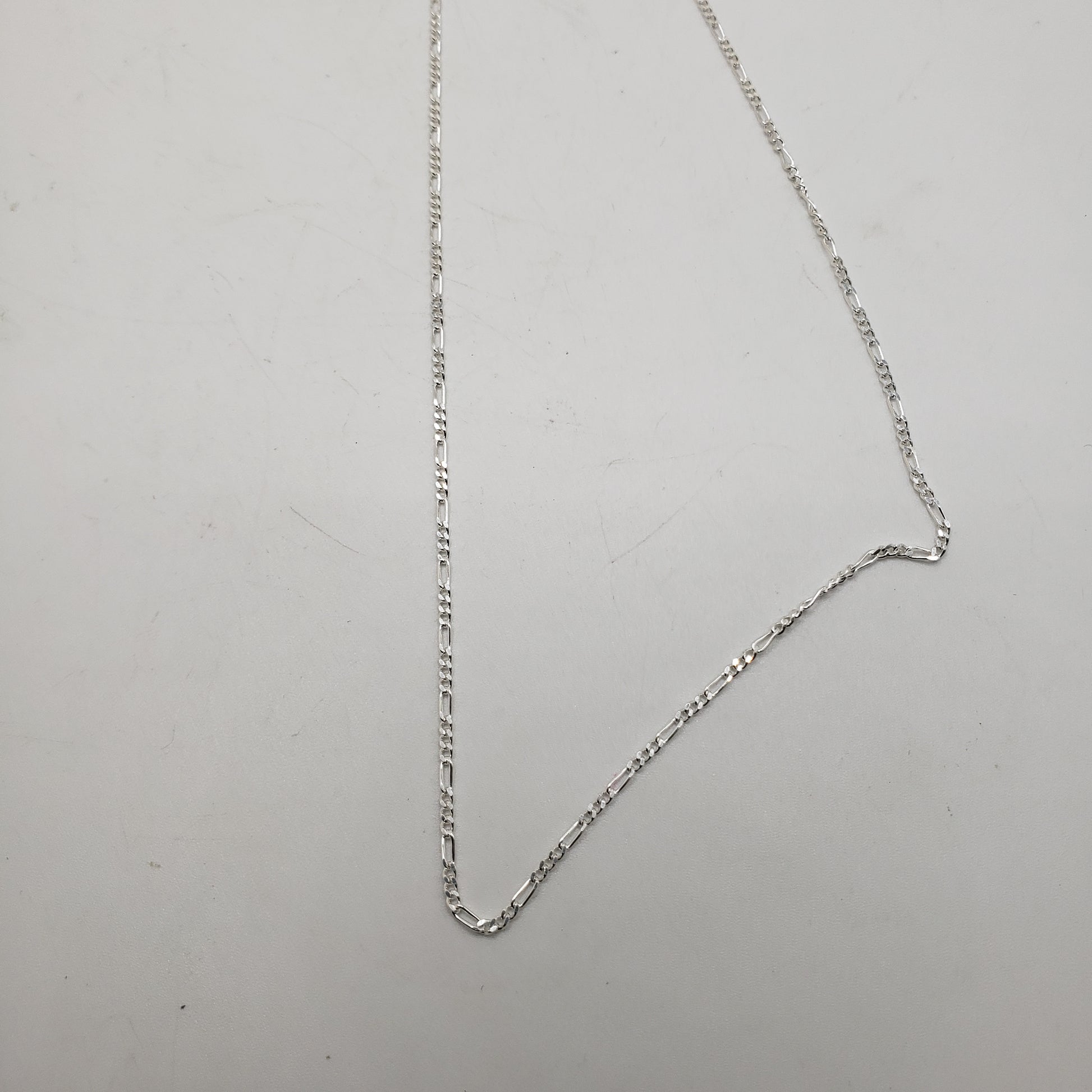 16 Inch Long Sterling Silver Figaro Link Chain.