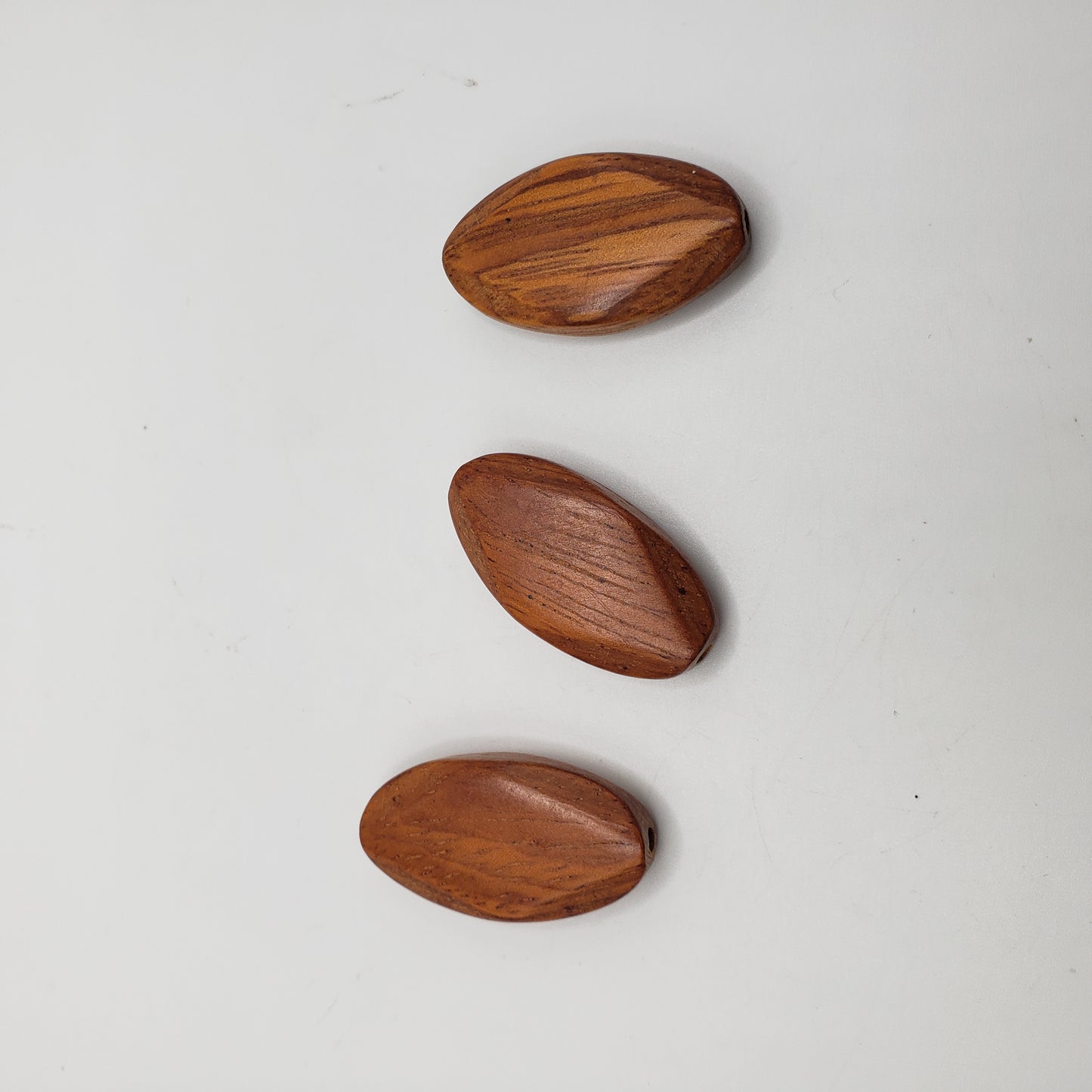 Red Wooden Oval Faceted Single Bead