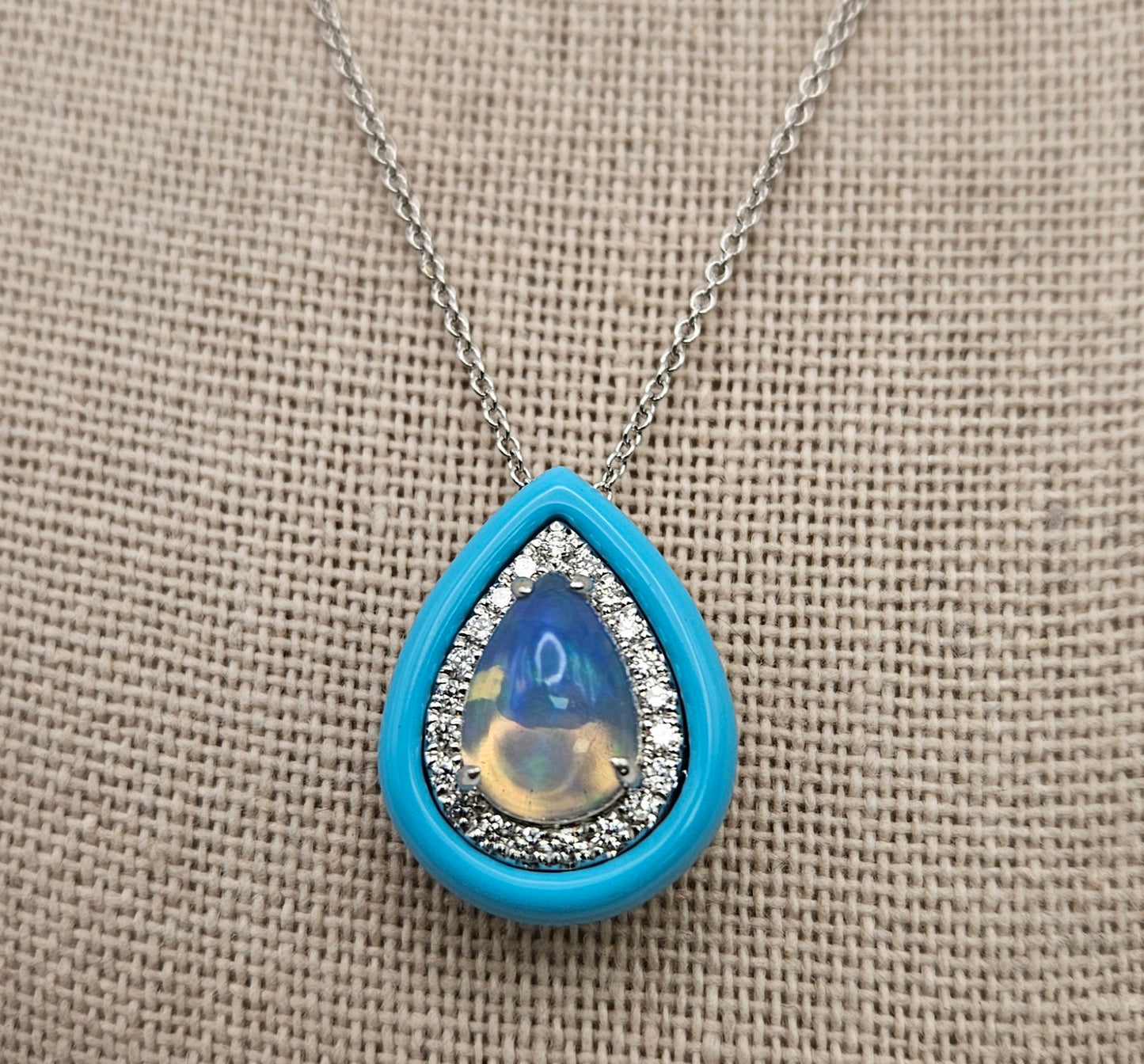 18 Kt White Gold Pear Shape Opal Diamond Pendant.