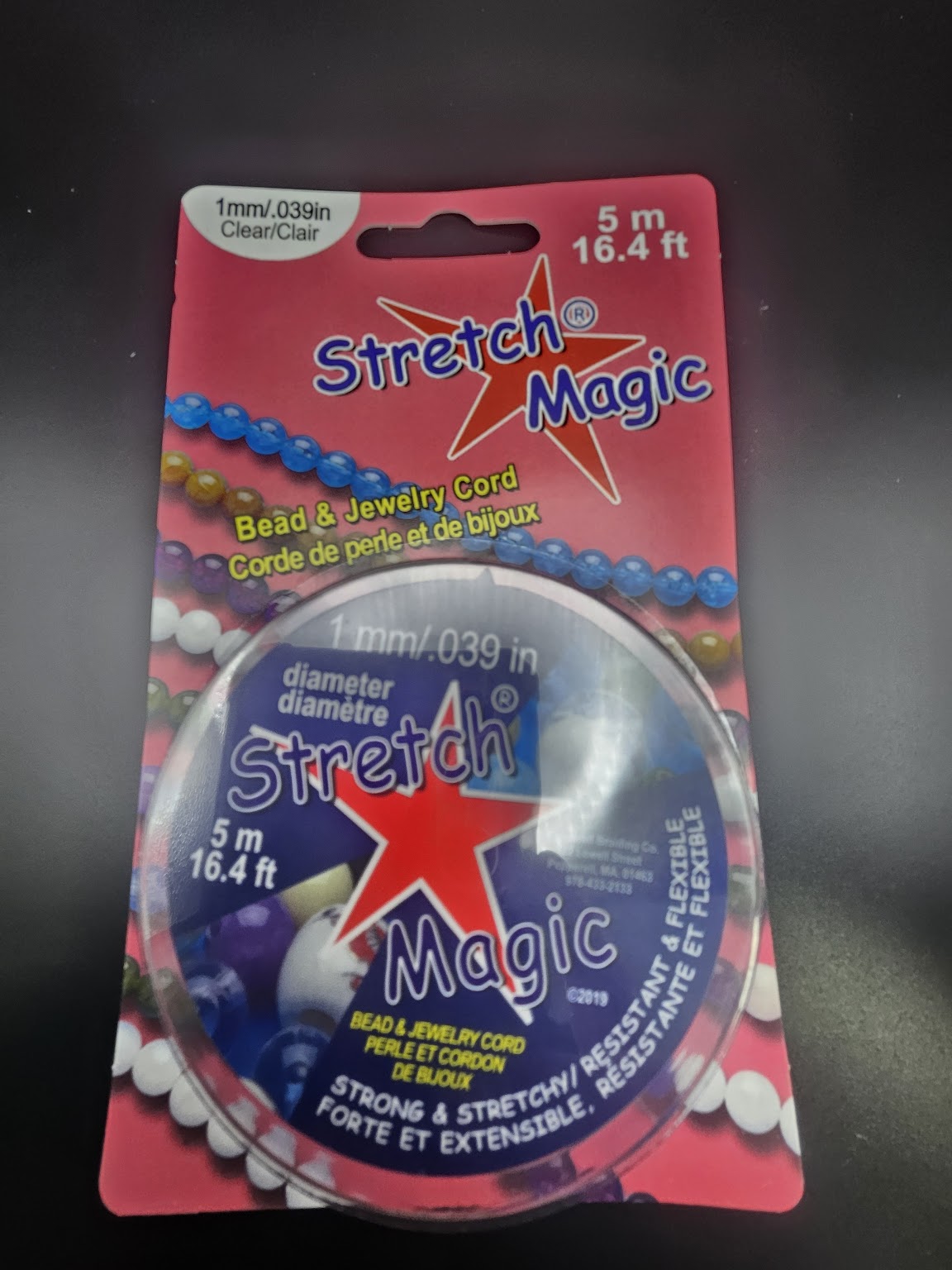 Package of 1MM Stretch Magic clear bead and jewelry cord, with a diameter of 1mm (0.039in) and a length of 5 Meters (16.4ft).