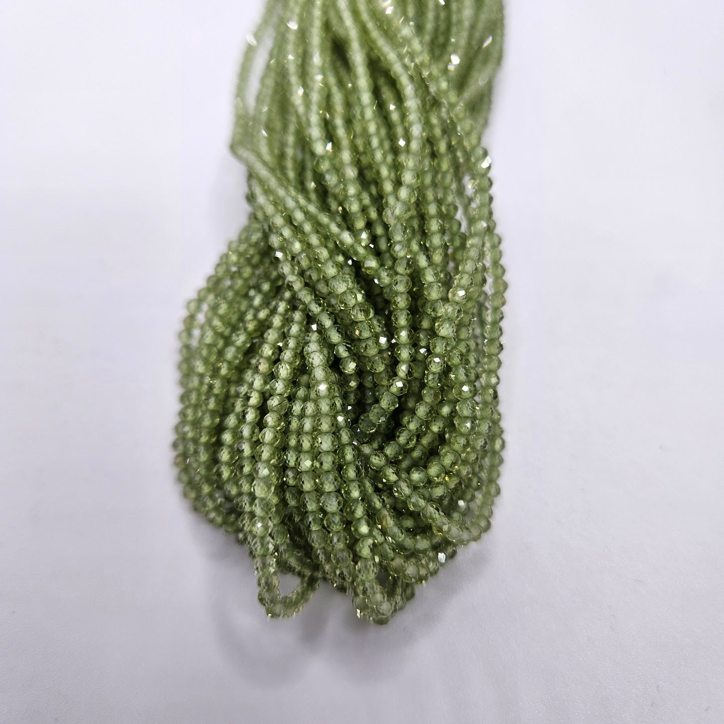 1mm Peridot Faceted Strand.