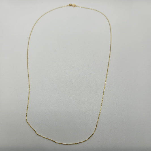 An 18" Fine Gold Cable Chain necklace delicately displayed against a plain white background, featuring a thin chain forming a gentle oval shape.