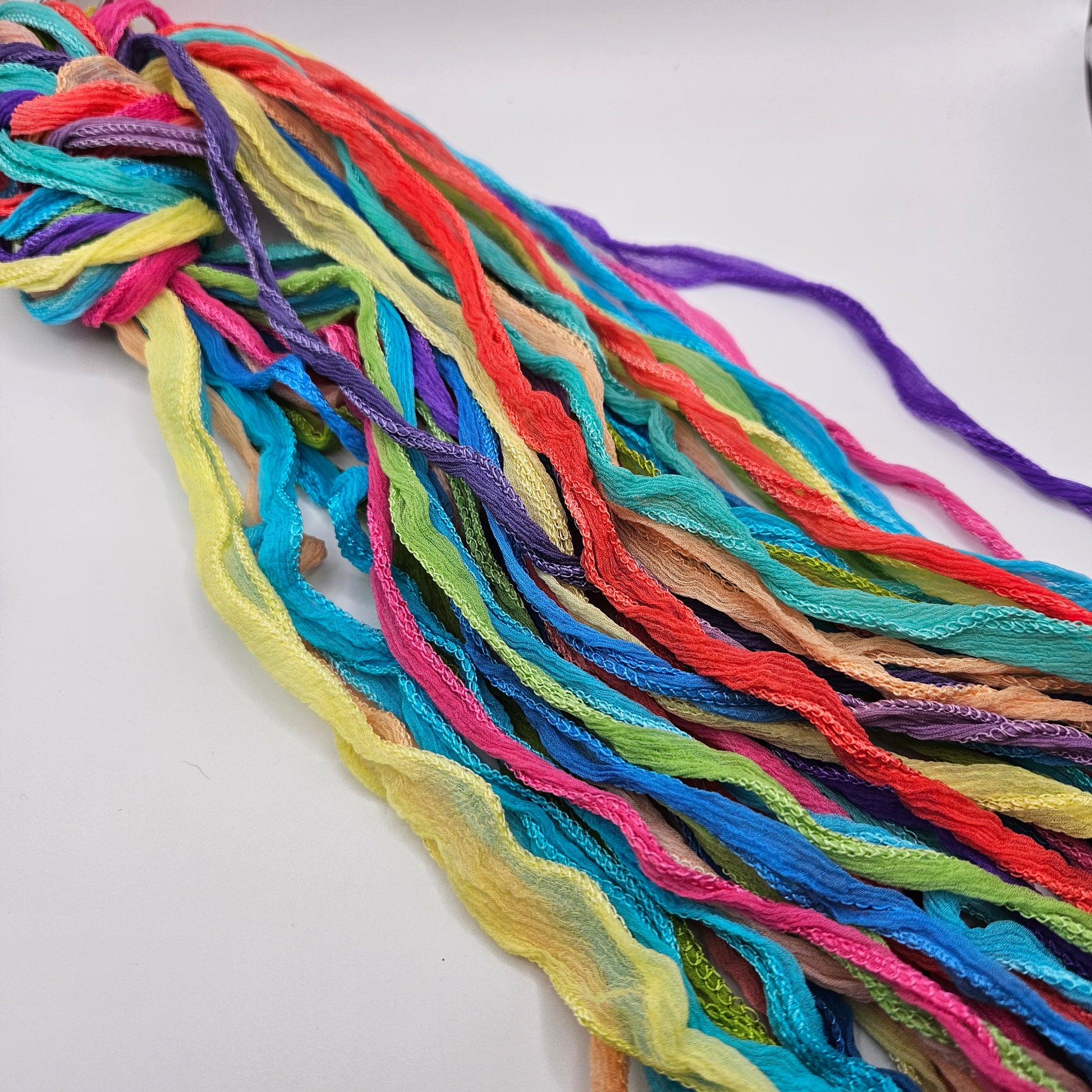 A collection of colorful fairy ribbons assorted in multiple colors