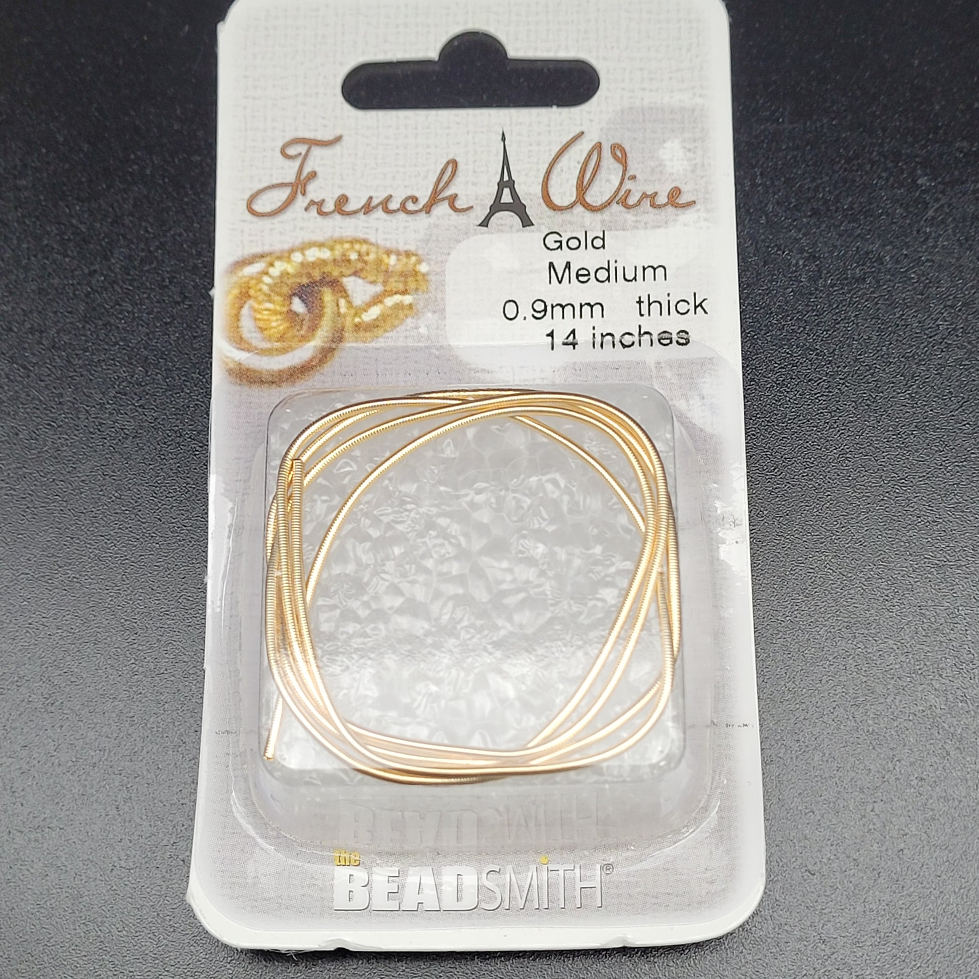 Packaged .9mm medium French wire in gold color
