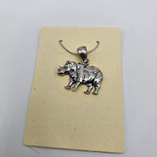 A sterling silver rhino pendant