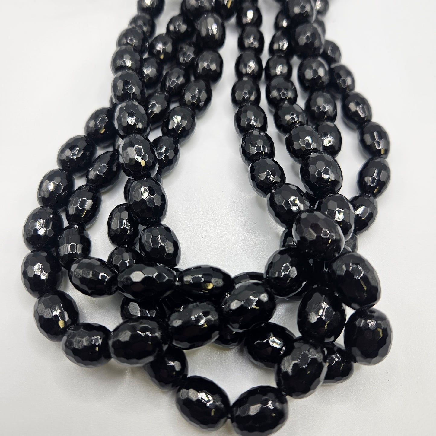 12mm Faceted Black Onyx Oval Bead Strand