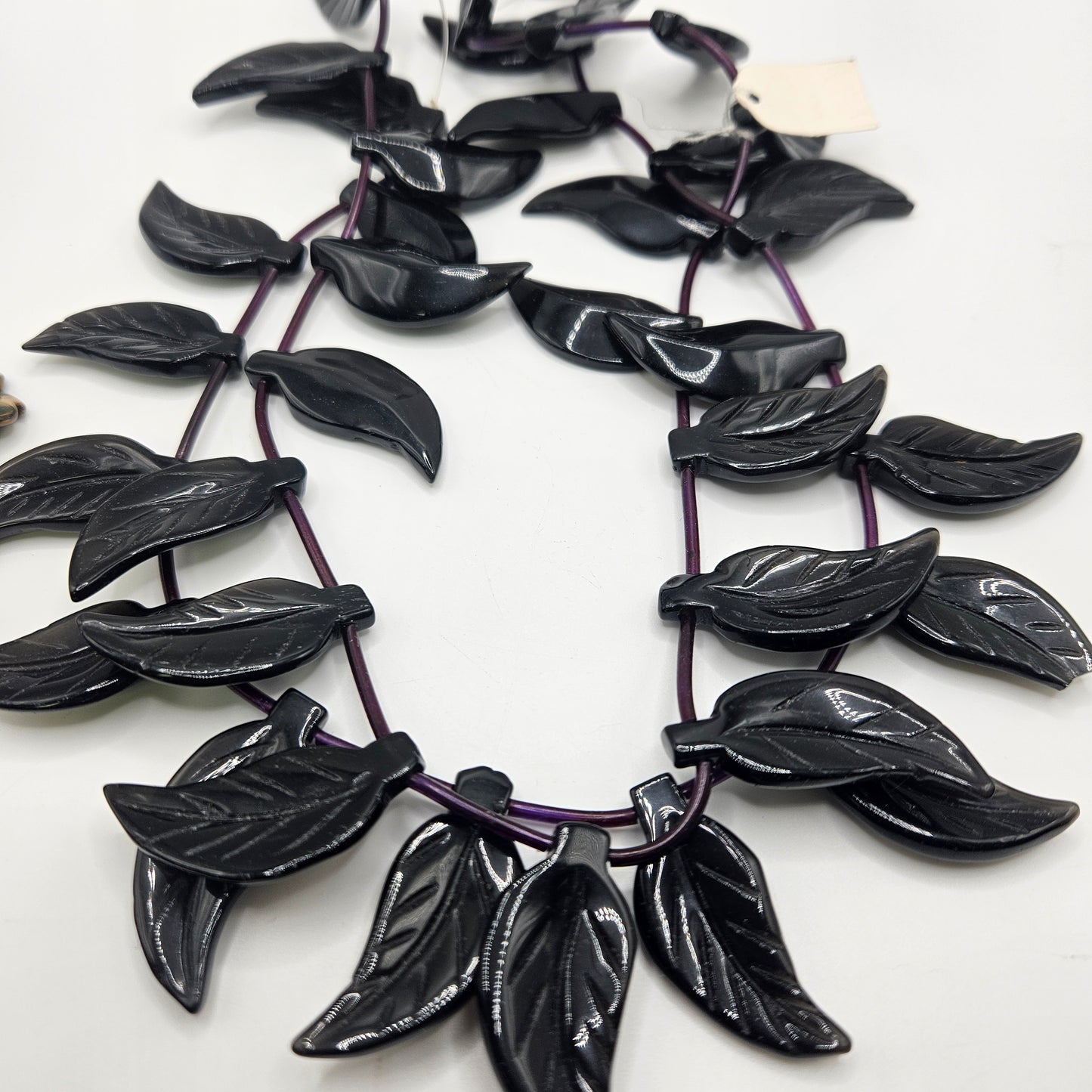 30mm Black Onyx Carved Leaf Bead Strand.