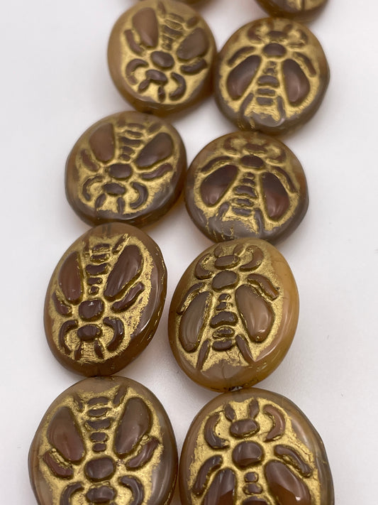20mm Gold Bee Oval Czech Bead Strand.