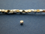 2mm by 2.5mm faceted sterling silver bead.