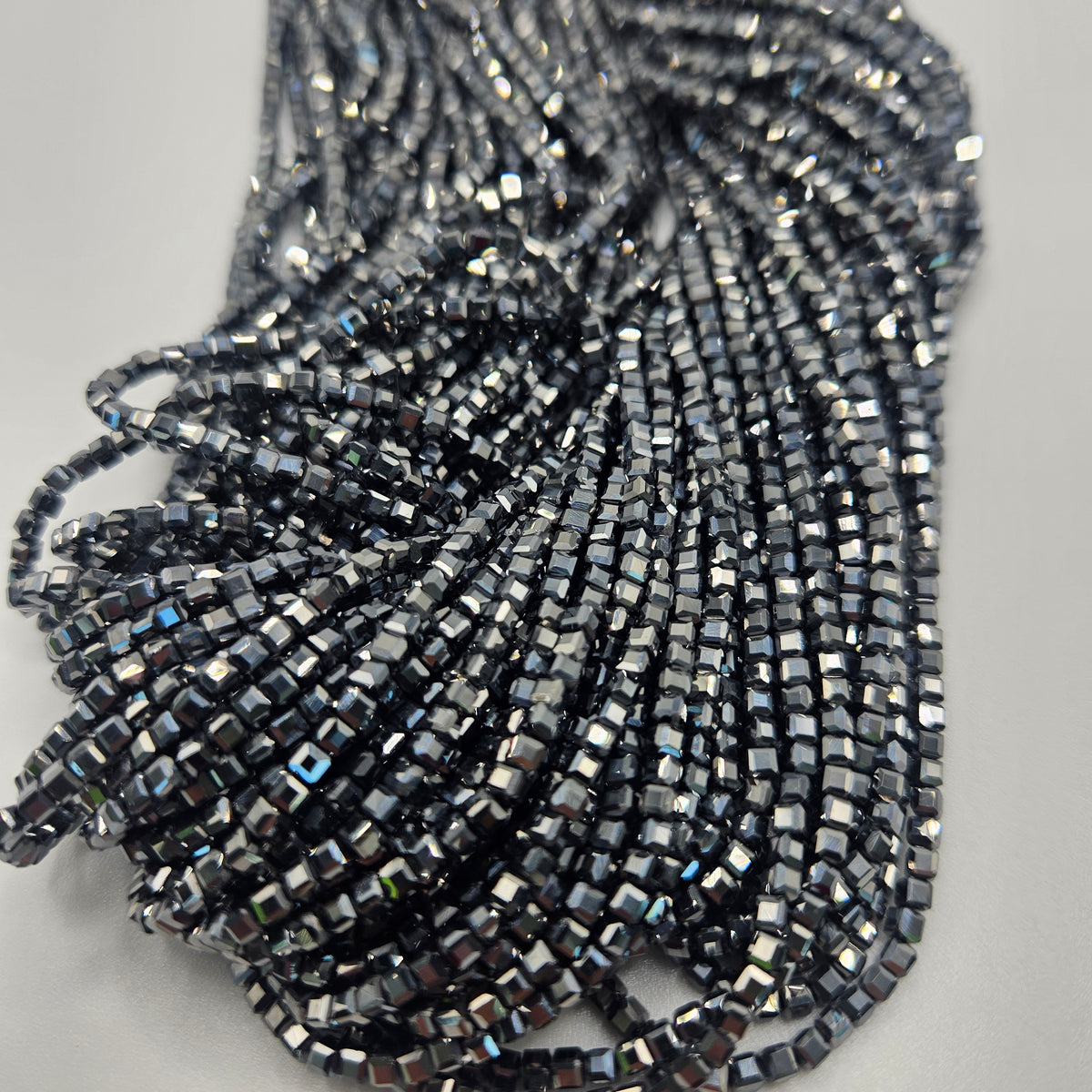 2mm Faceted Hematite Cube Bead Strand.