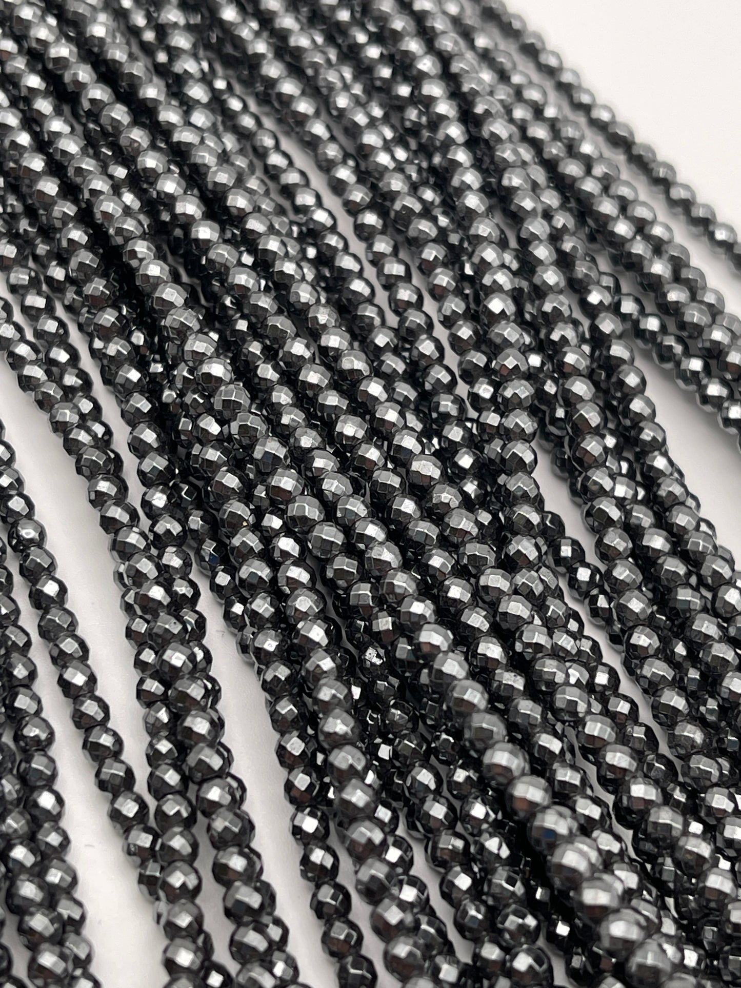 3mm Hematite Faceted Round Bead Strand.
