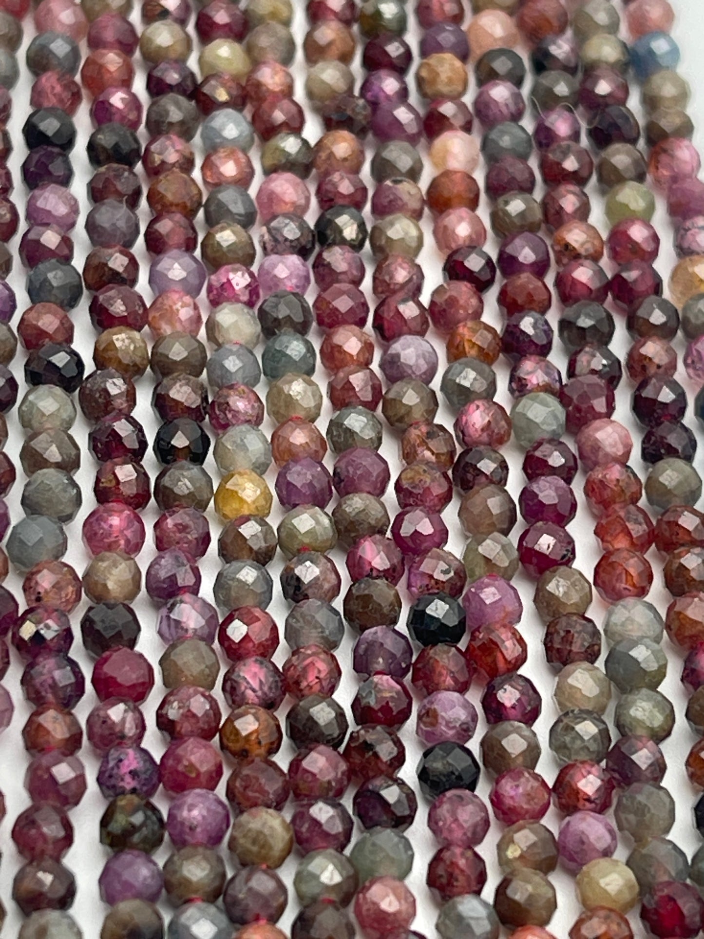 3mm Ruby, Sapphire, And Spinel Faceted Round Bead Strand.