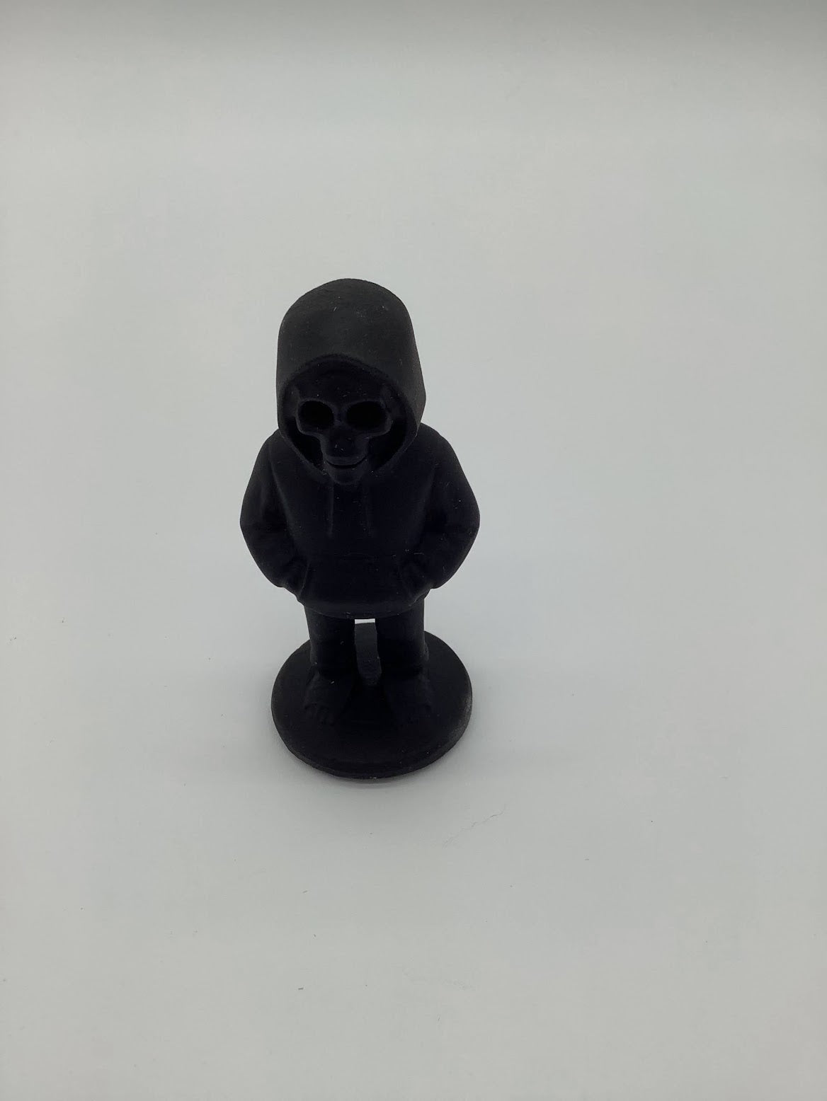 4 inch Obsidian Skeleton in Hoodie.