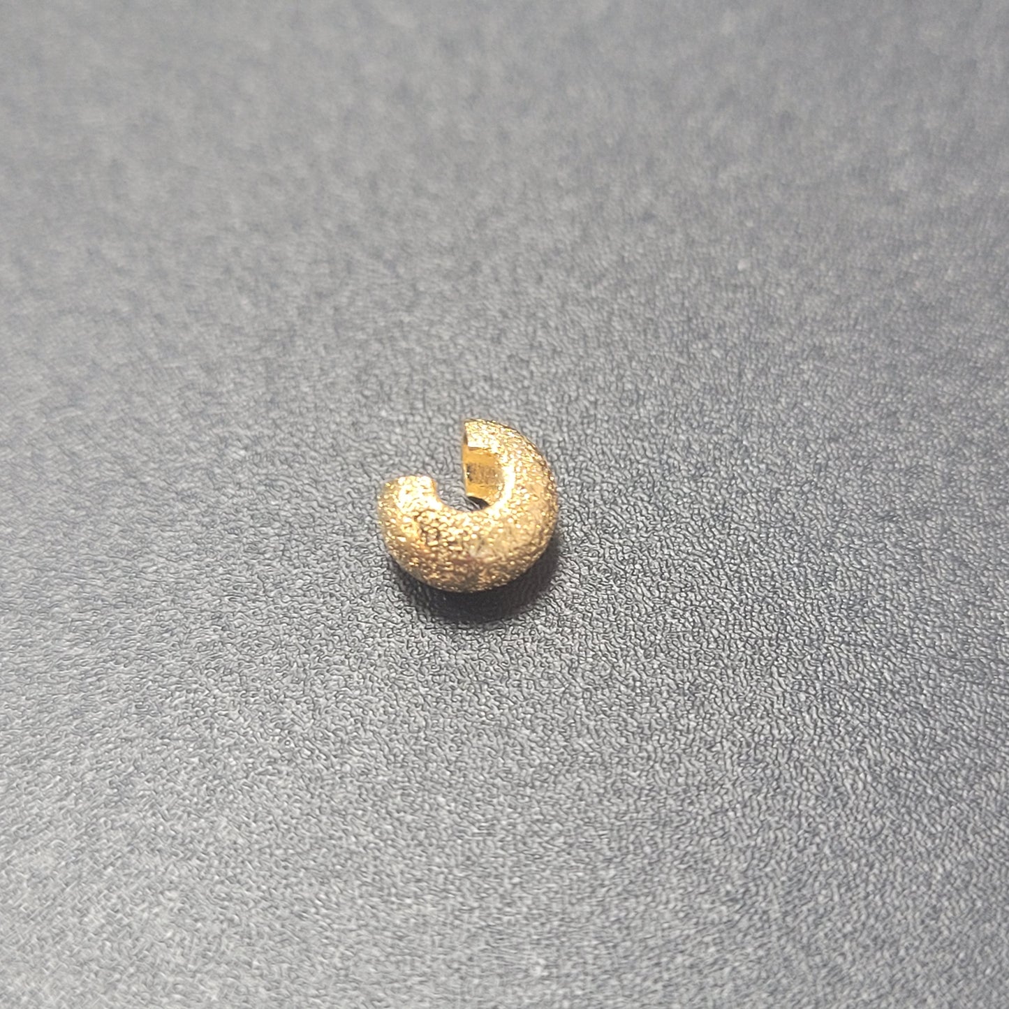 4MM CRIMP BEAD COVER 4MM GOLD PLATED SOLD INDIVIDUALLY.