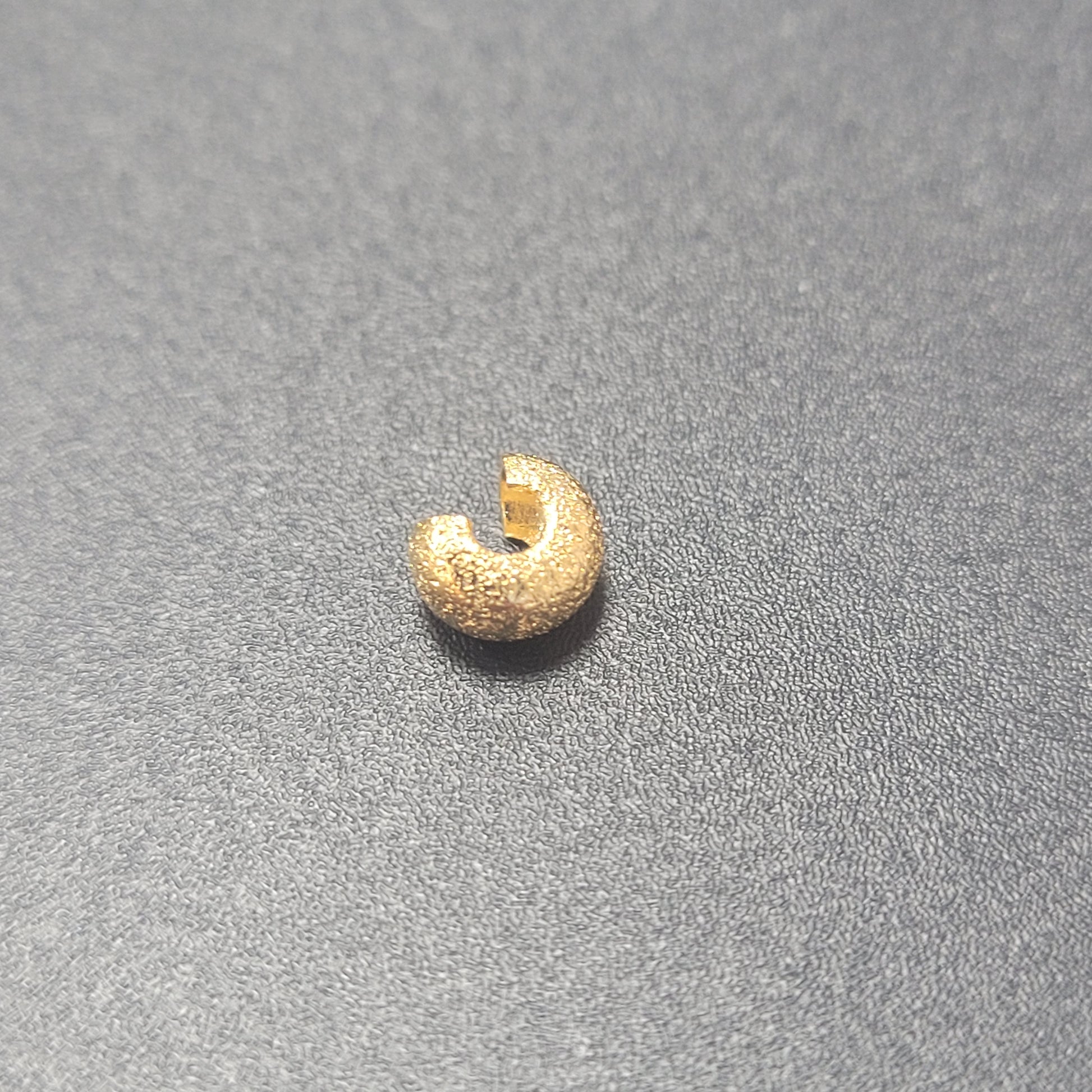 4MM CRIMP BEAD COVER 4MM GOLD PLATED SOLD INDIVIDUALLY.