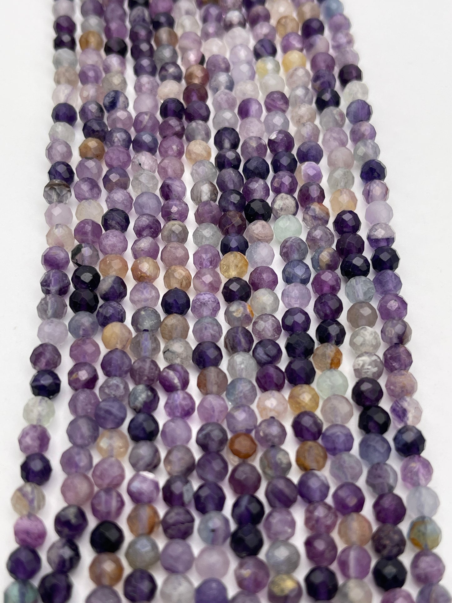 4mm Fluorite Faceted Round Bead Strand.