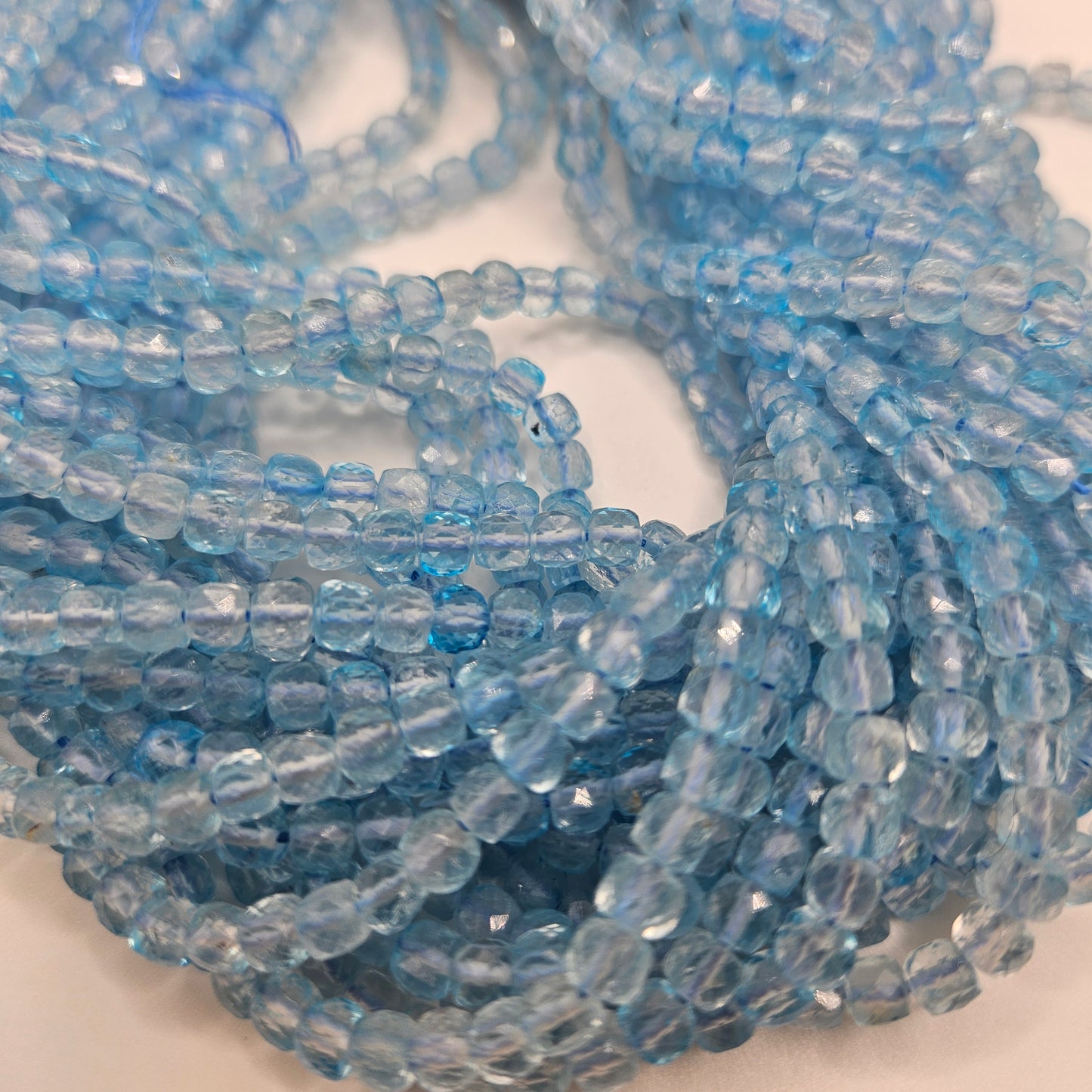 4mm Blue Topaz Faceted Cube Bead Strand.