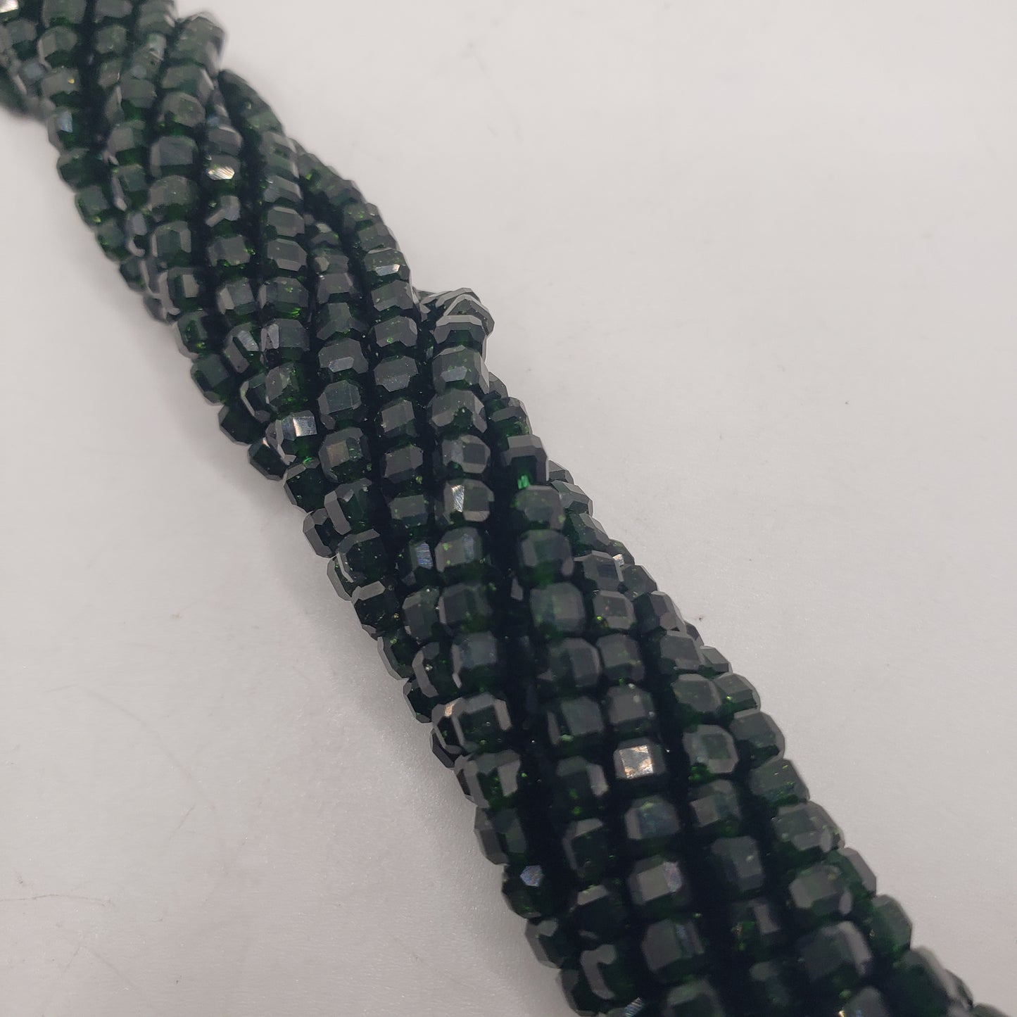 4mm Cube Green Goldstone Bead Strand.