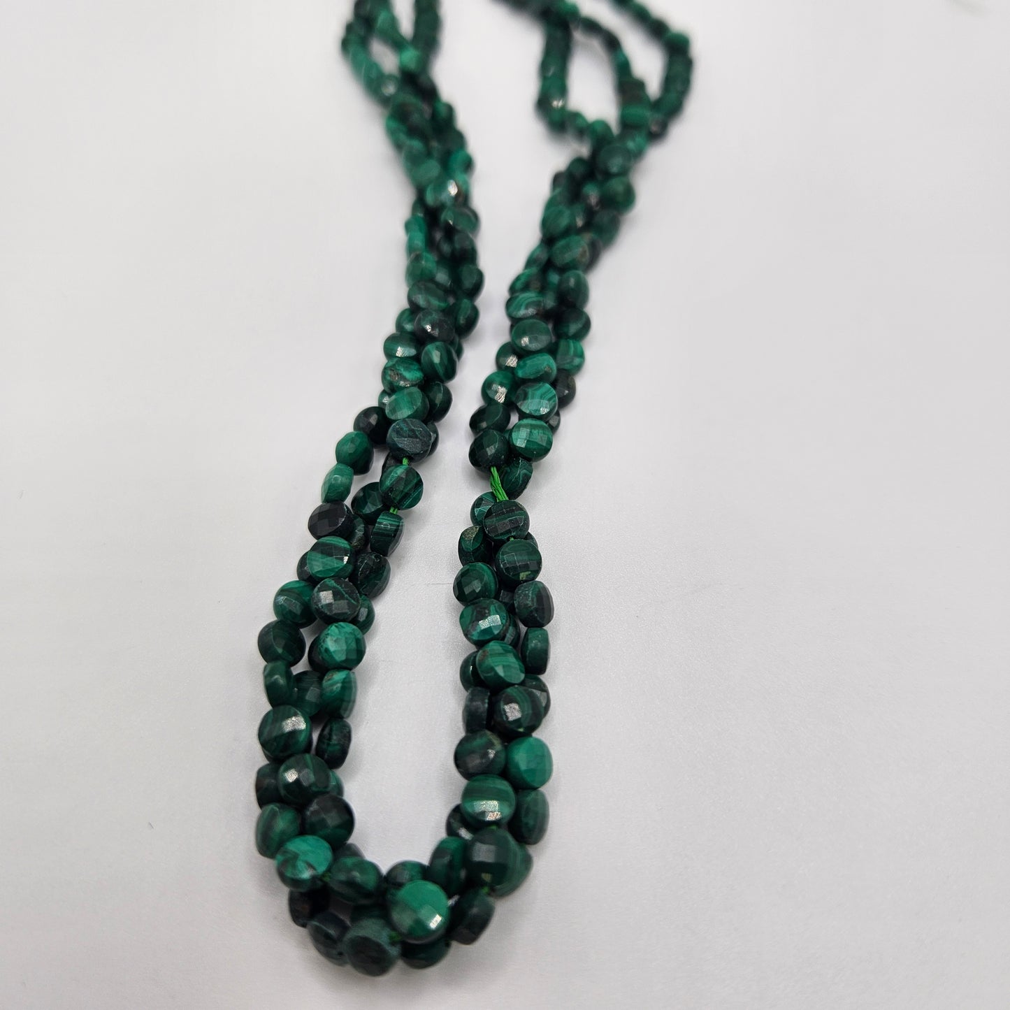 4mm Malachite Faceted Coin Bead Strand.