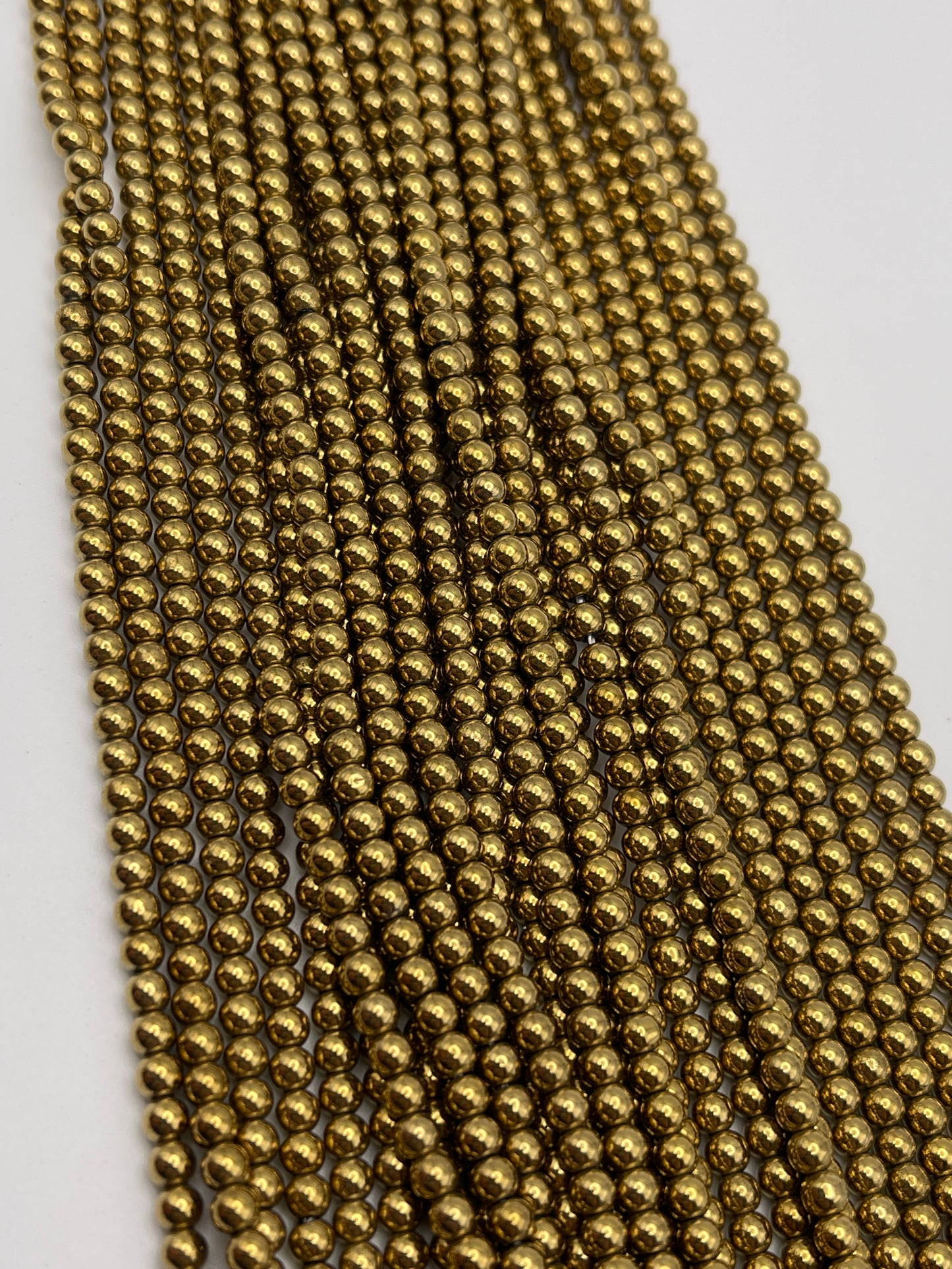 5mm Hematite Gold Round Bead Strand.