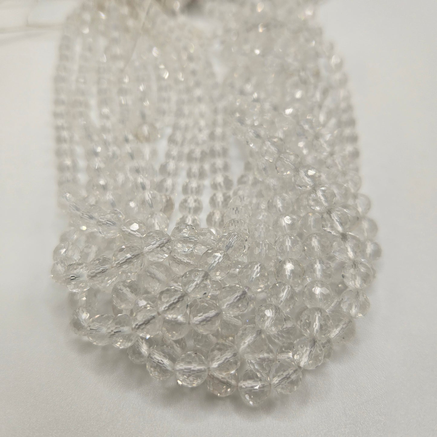 6mm Clear Quartz Faceted Round Bead Strand.