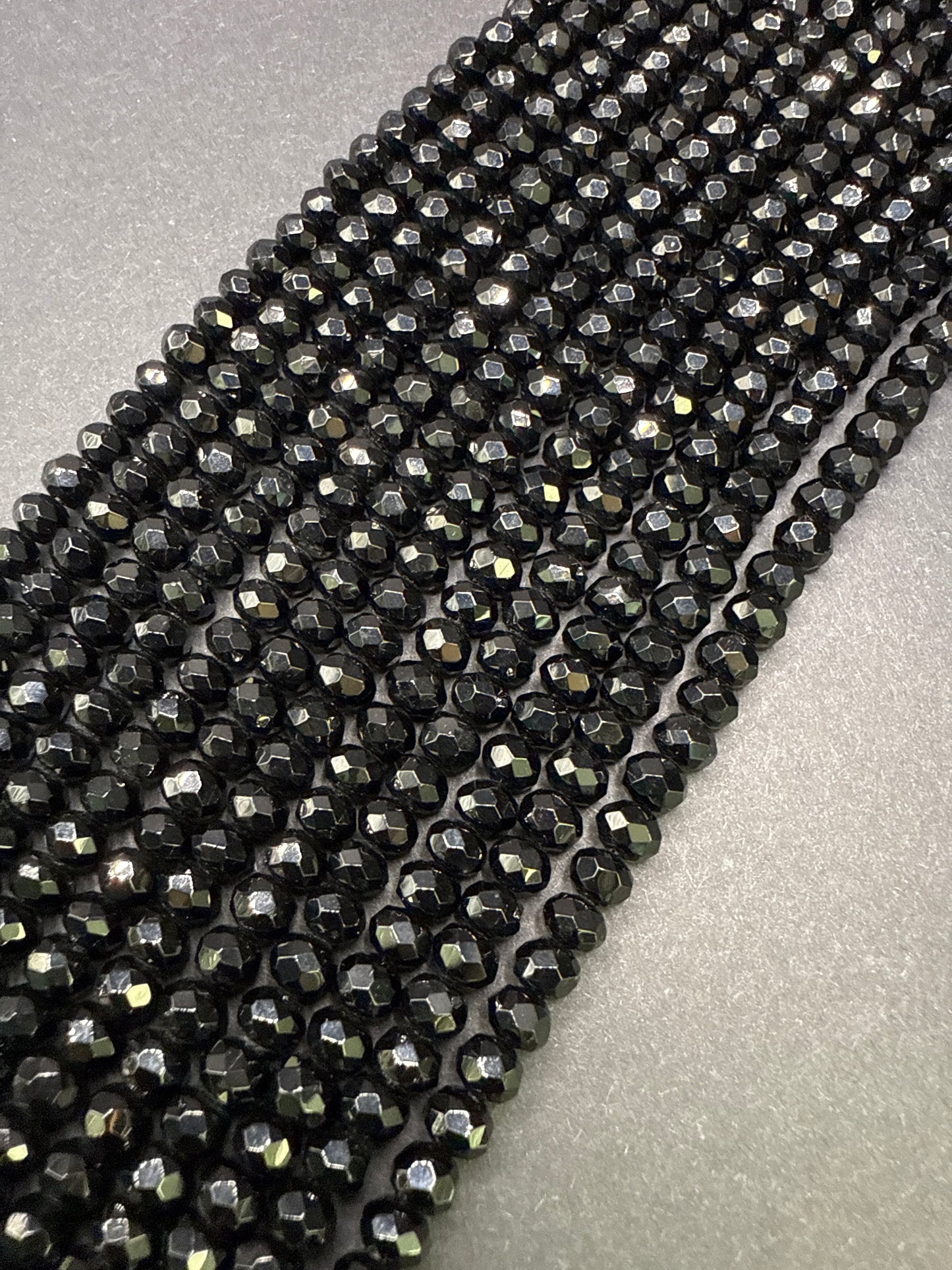 6mm Onyx Faceted Rondell.