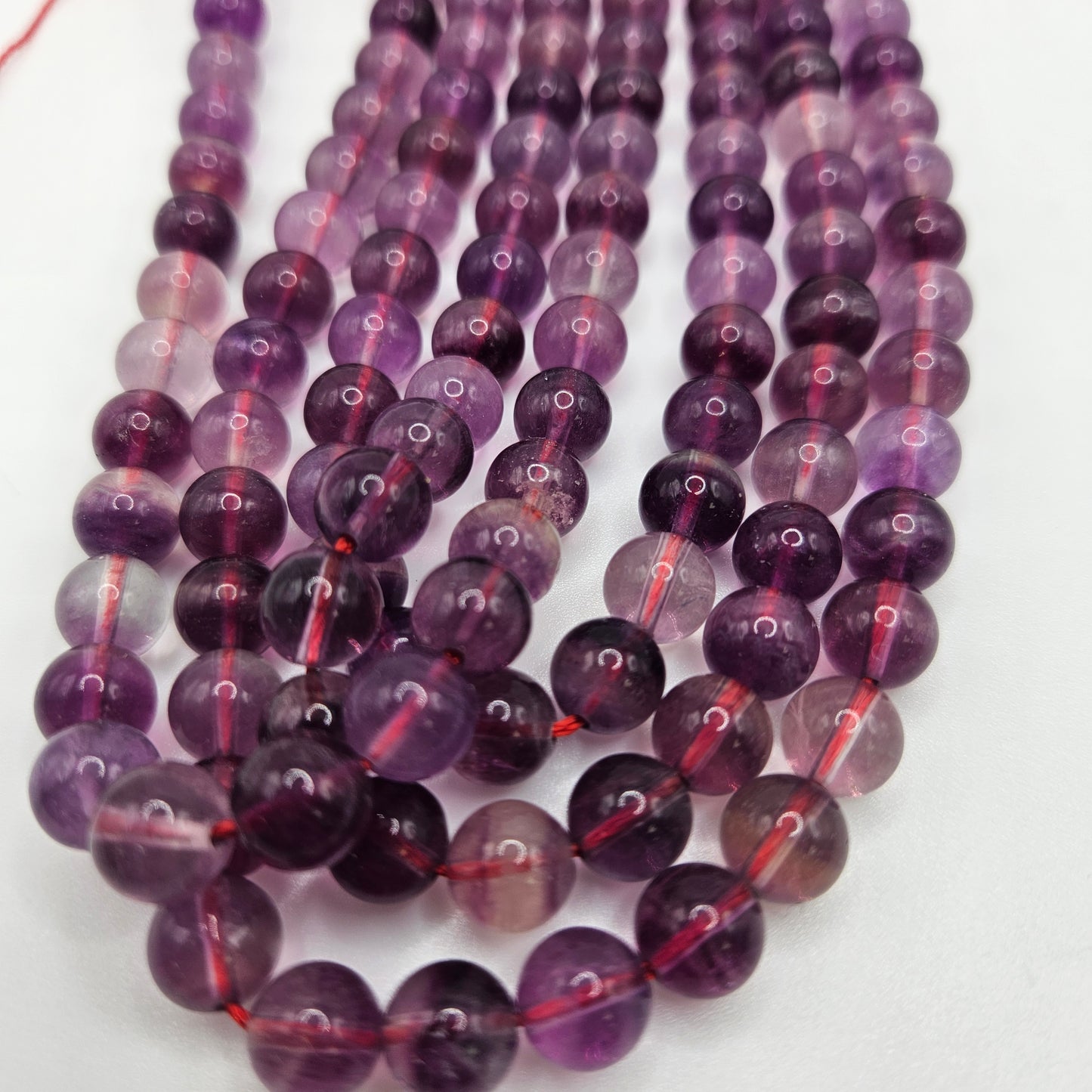6mm Purple Fluorite Round Bead Strand.