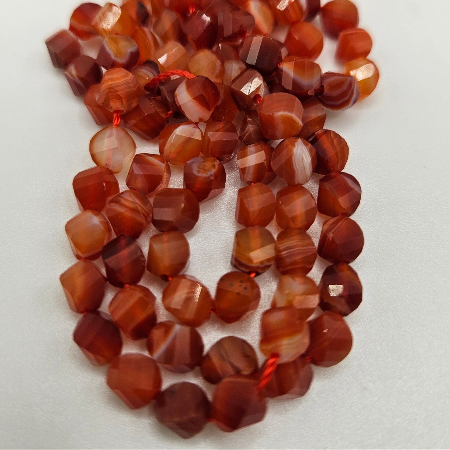 6mm Red Agate Faceted Round Bead Strand.
