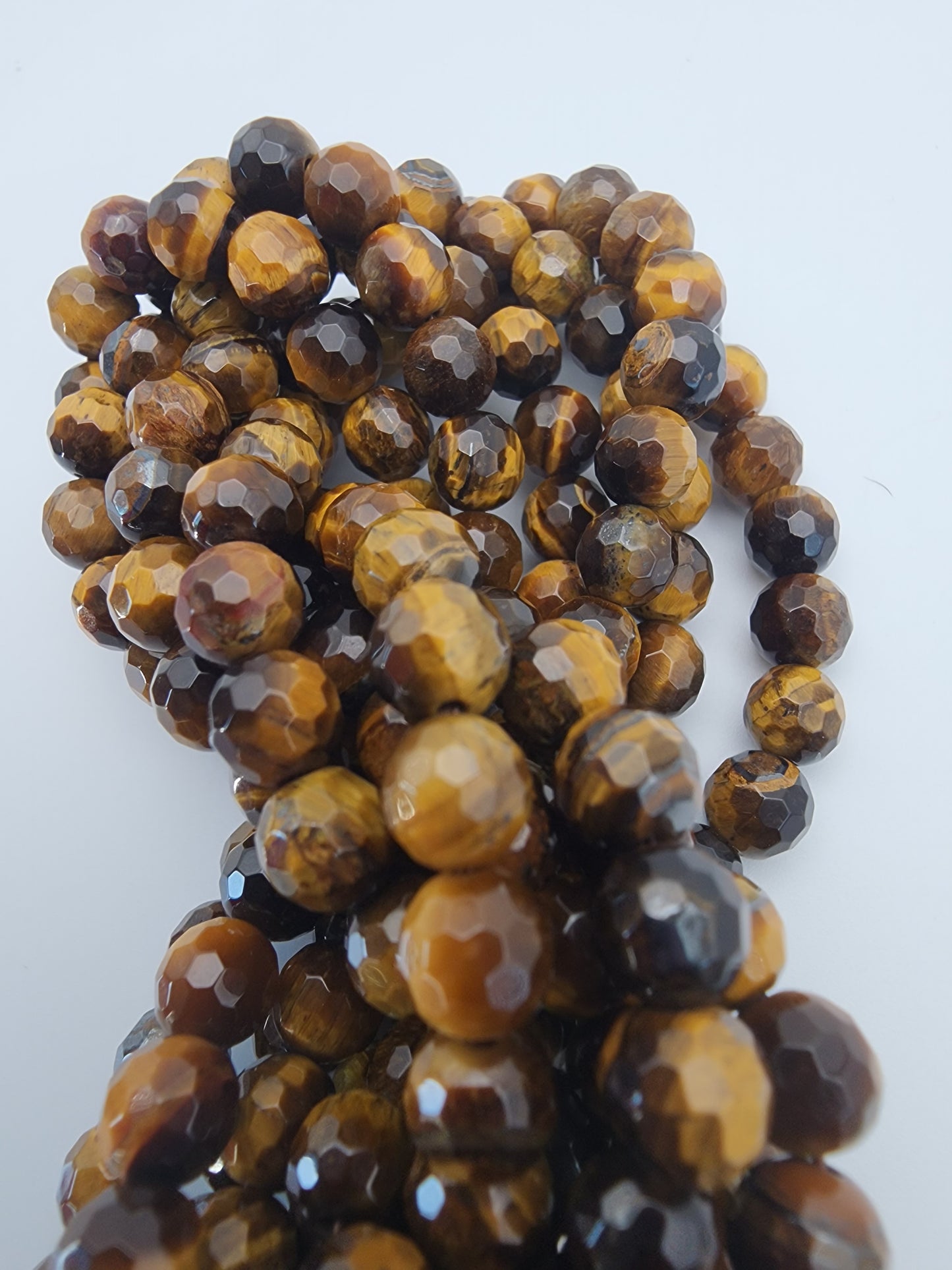 6mm Tiger's Eye Faceted.