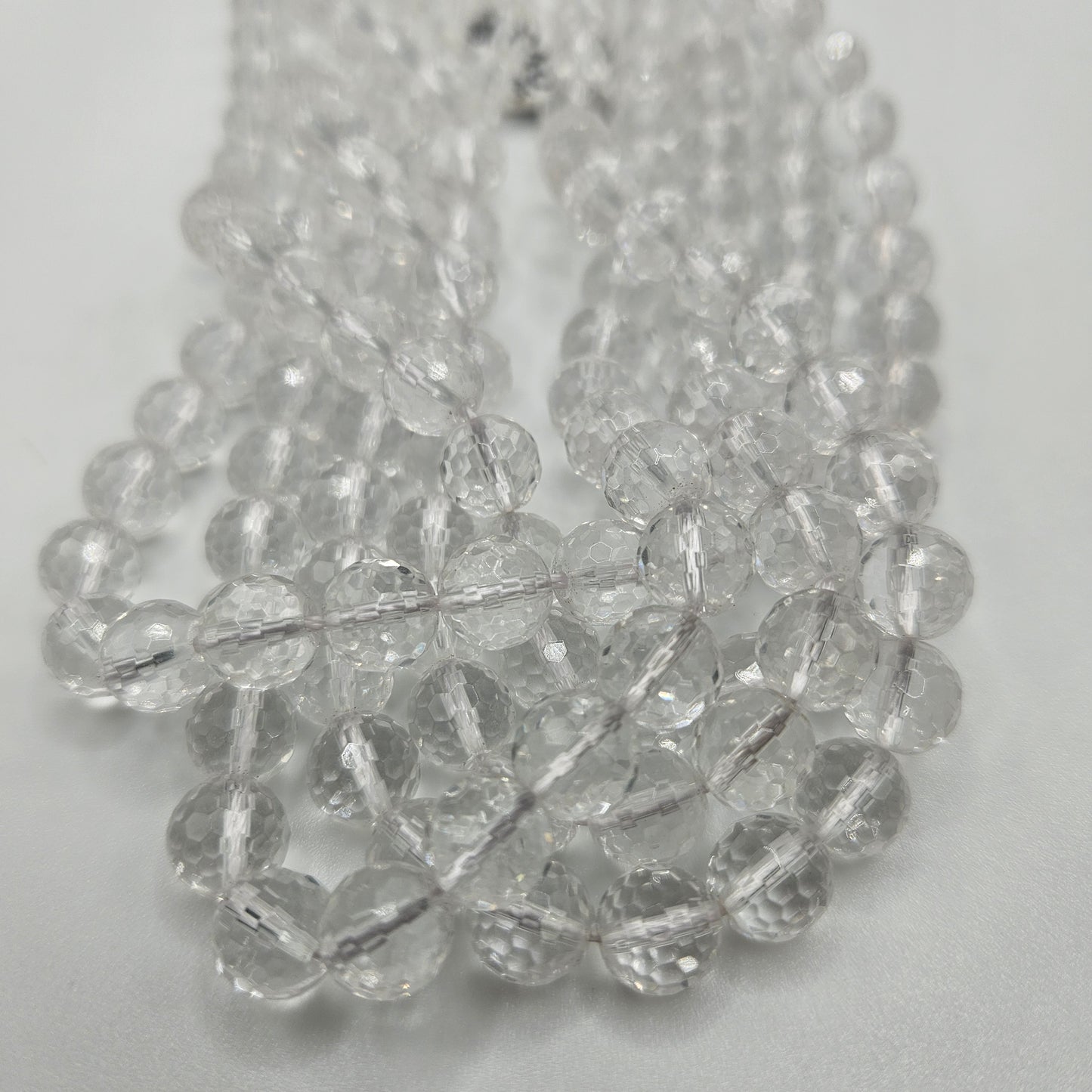 8mm Clear Quartz Faceted Round Bead Strand.