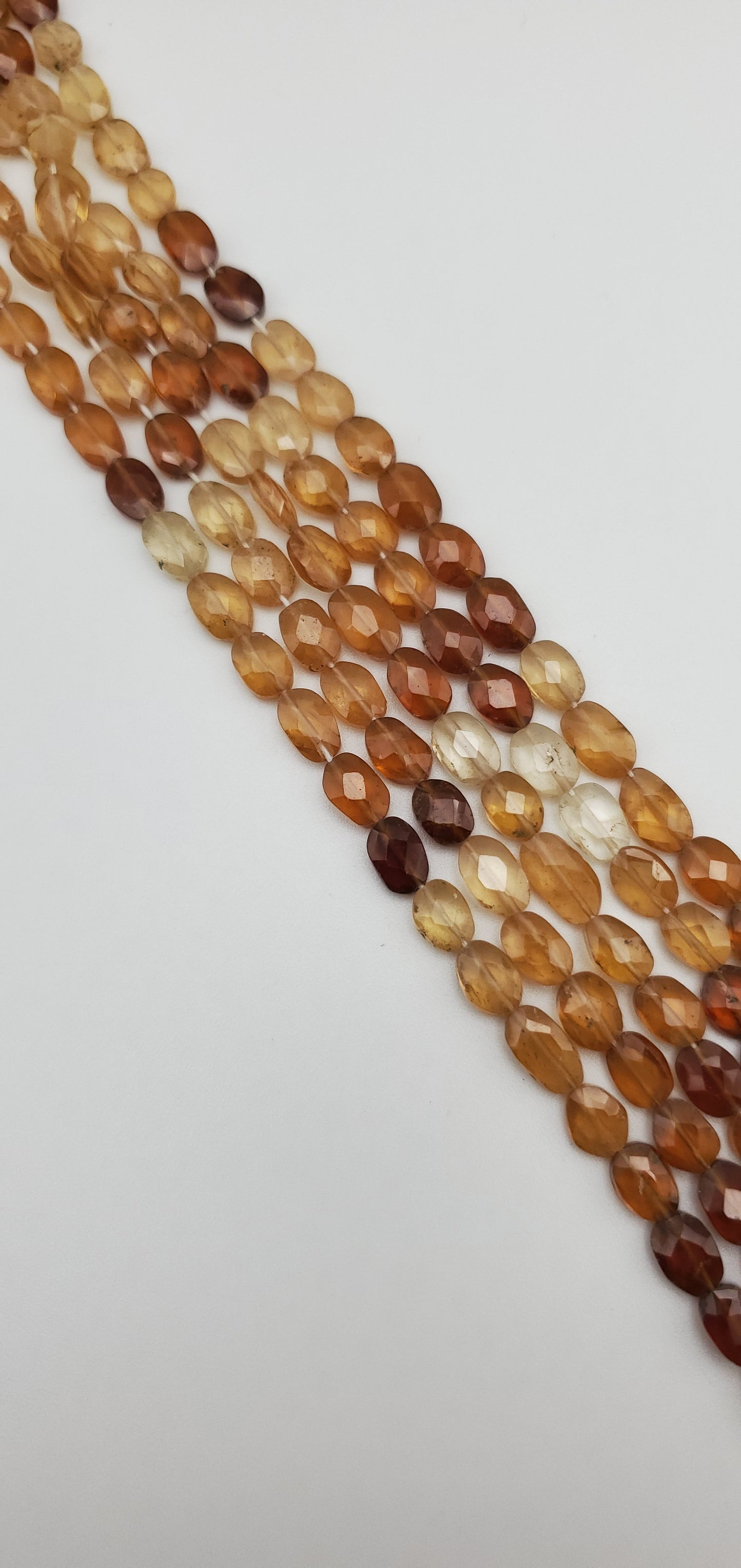 8mm Hessonite Garnet Faceted Oval Bead Strand.