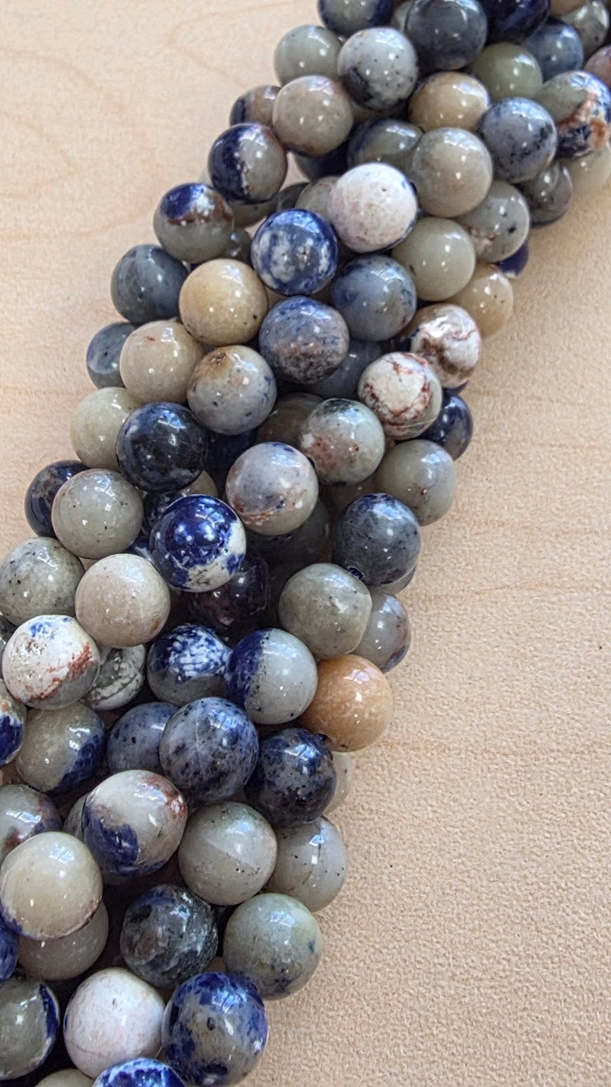 8mm Orange Sodalite Bead Strand.