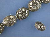 Oval shaped silver bead with moon and star decoration