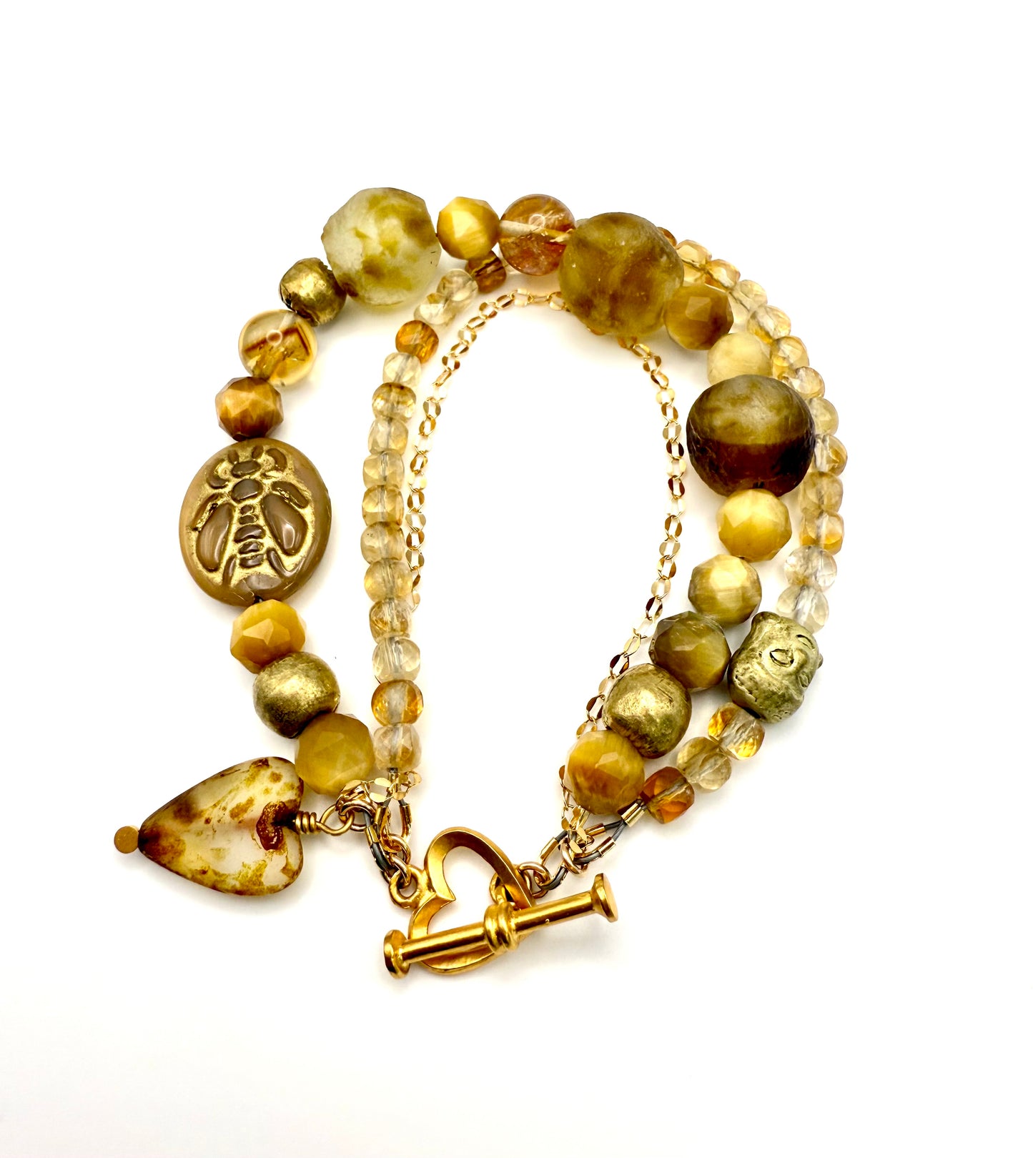 Golden Honey 3 strand statement bracelet. Citrine, yellow tigers eye, Czech glass, African beads with a vermeil heart toggle.