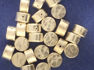 SS High Polished hammered hockey puck bead holes are thru the sides 8 mm hole to hole 5 mm wide